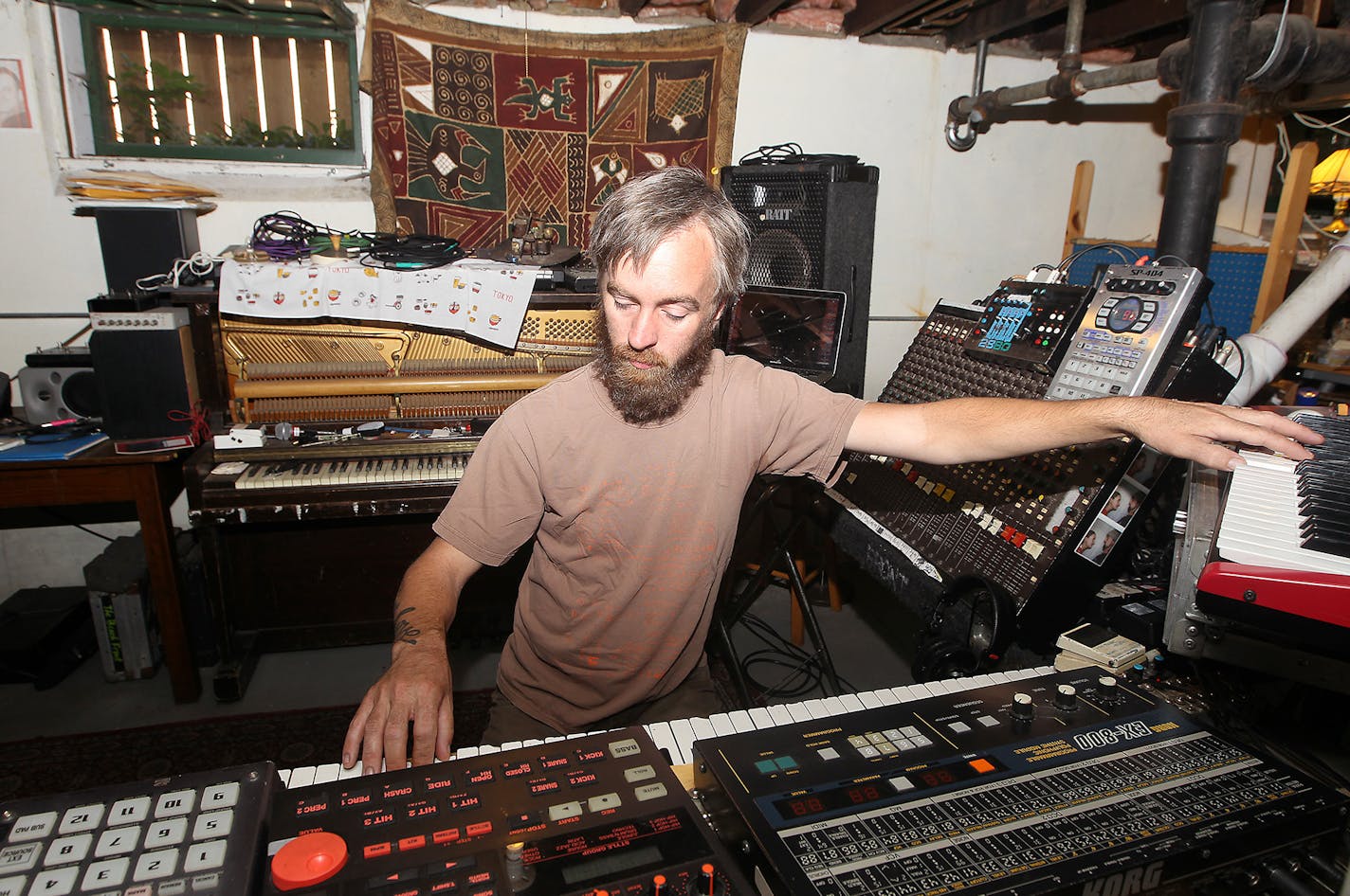 Martin Dosh worked in his home studio composing the score for the film "Universe," which will play at the Square Lake Film Festival, Friday, July 31, 2015 in Minneapolis, MN. ] (ELIZABETH FLORES/STAR TRIBUNE) ELIZABETH FLORES &#xa5; eflores@startribune.com