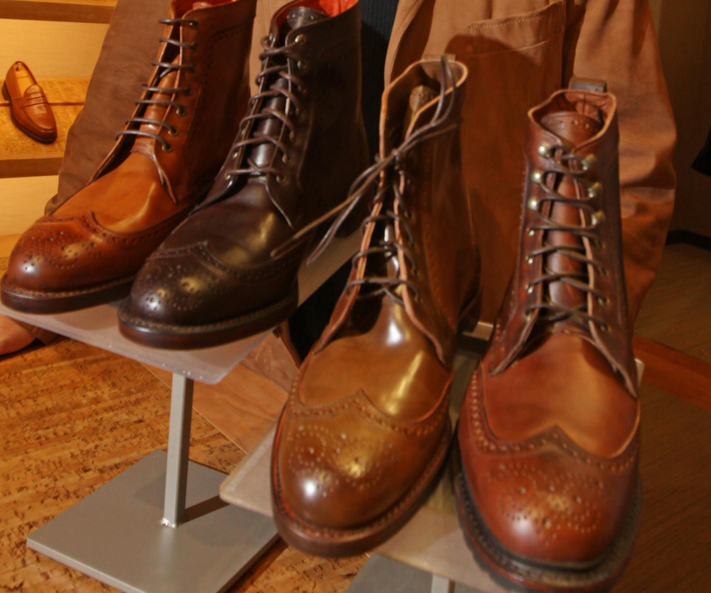 Designer James Dayton with the Dalton dress boot he designed for the Allen Edmonds shoe stores. Dayton also designed the interior of the Edmonds shoe stores, the first store store to use the design was in the City Center in downtown Minneapolis. Dayton was photographed on 12/23/11.] Bruce Bisping/Star Tribune bbisping@startribune.com James Dayton/source. ORG XMIT: MIN2013110418015962