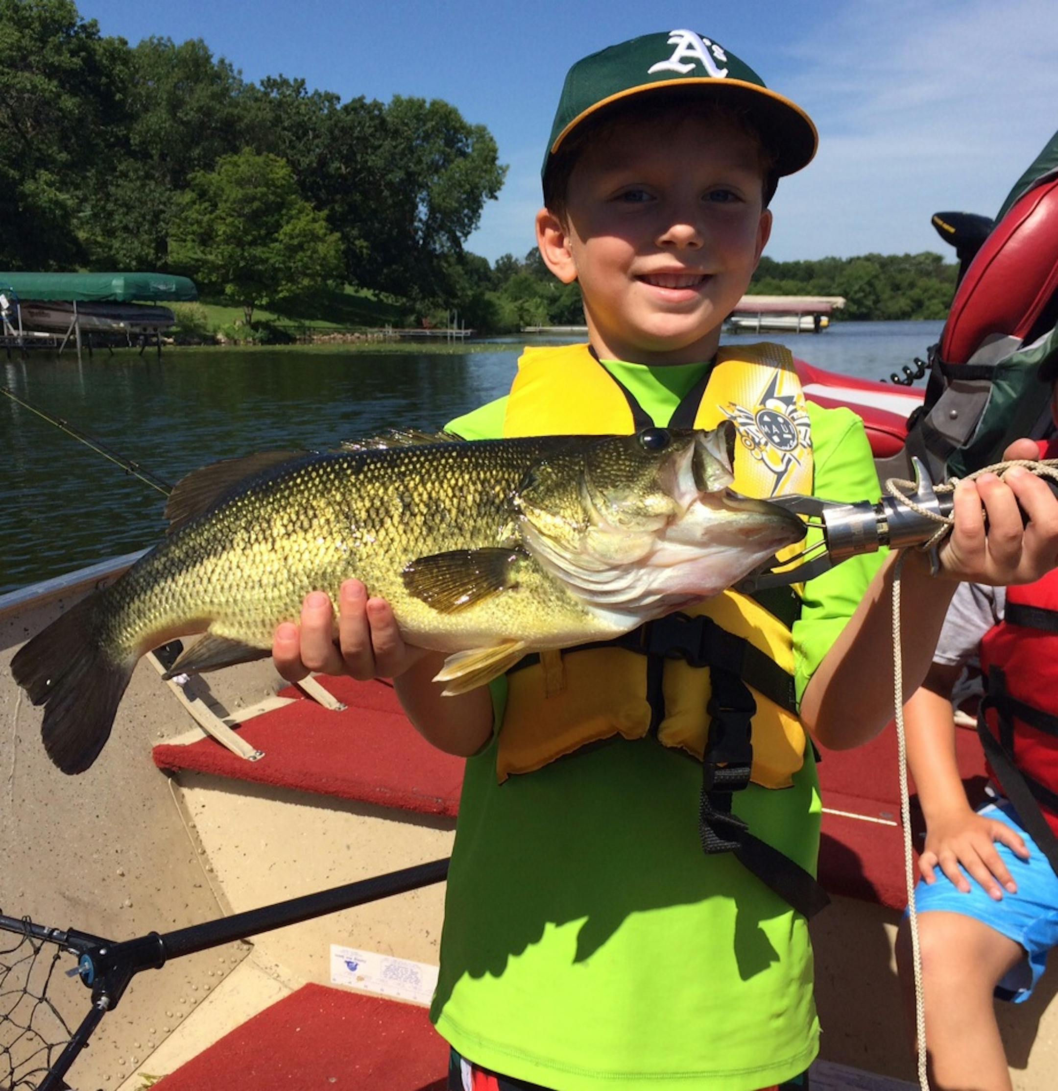 Max Koltnow, 7, Eden Prairie, caught this bass on a metropolitan area lake within minutes of his brother catching an even larger one. The bass was caught on a metro area lake using a Wacky Worm.