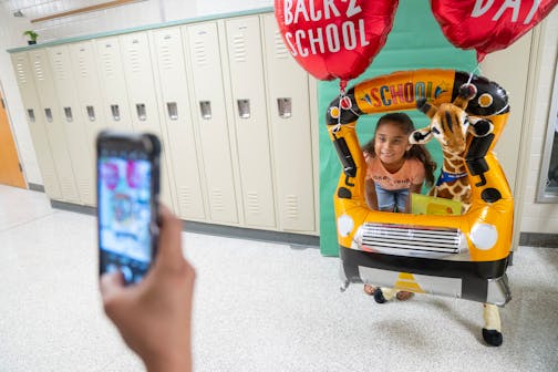 Savanah Watson poses for a photo during the first day of school Tuesday, Sept. 6, 2022, at Hayes Elementary School in Fridley, Minn.