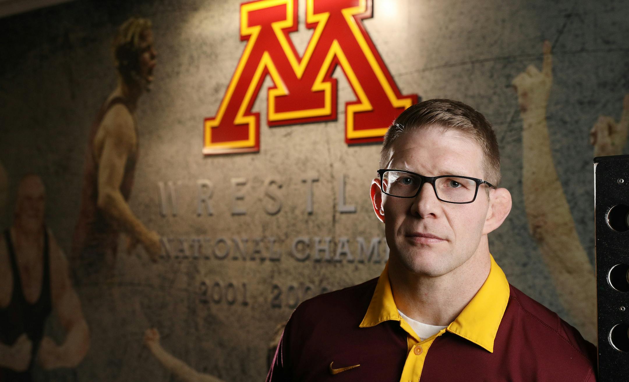 Brandon Eggum, the new wrestling coach for the University of Minnesota's Golden Gophers, stands for a portrait in the university's wrestling room Wednesday. ] ANTHONY SOUFFLE • anthony.souffle@startribune.com Feature on new Gophers wrestling coach Brandon Eggum photographed Wednesday, Jan. 4, 2017 at
