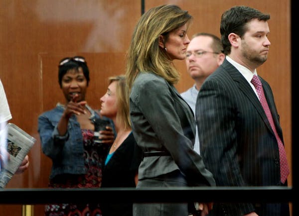 Amy Senser and attorney Eric Nelson waited in the security line at the Government Center on Monday.