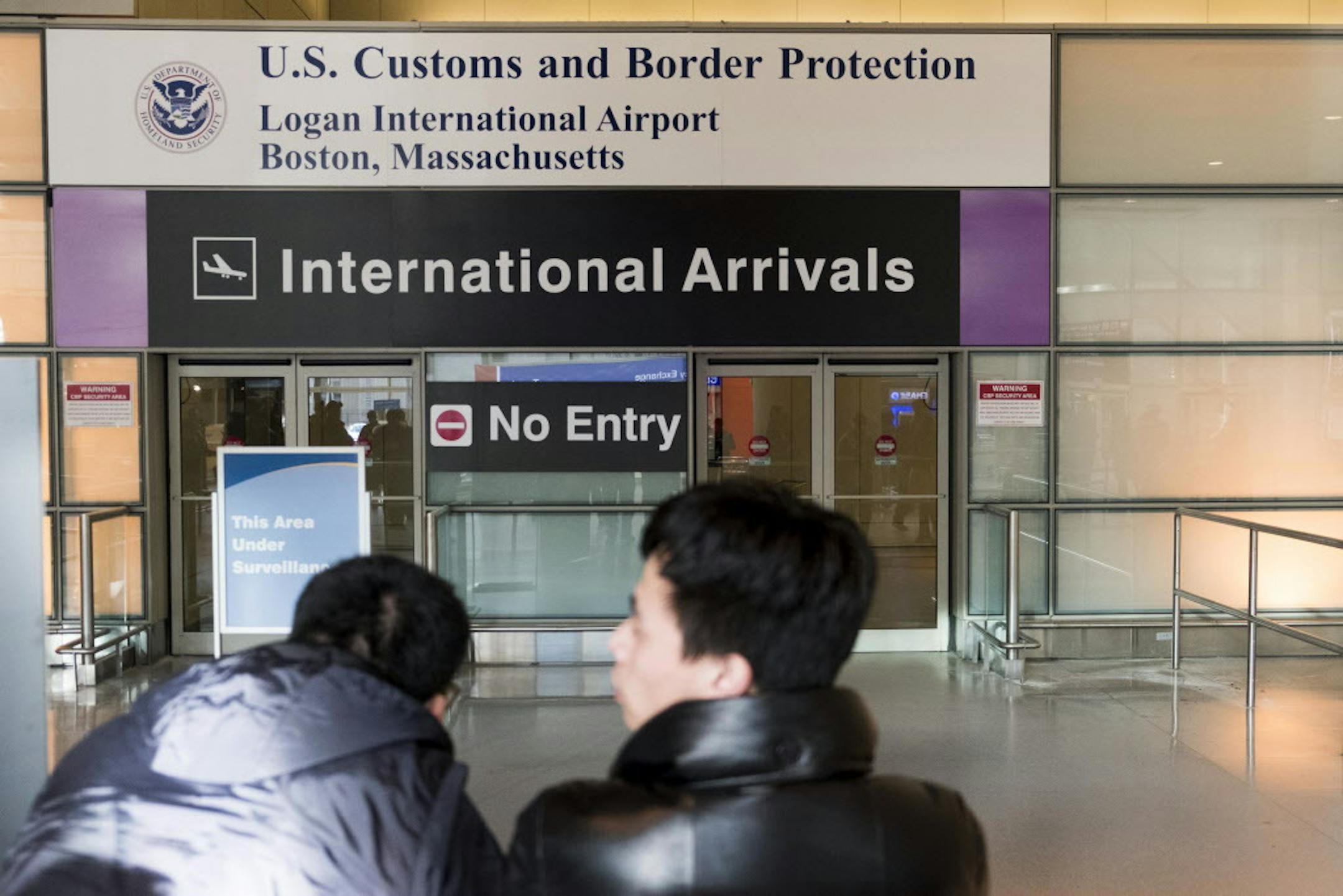 The international arrivals area of Logan Airport in Boston, Feb. 2, 2017. Much of the criticism of the executive order banning visas from certain countries signed by President Donald Trump has focused on foreigners prevented from entering the country, but a court filing in the legal battle over the travel ban reveals a far broader impact, imperiling the residency status of tens of thousands of immigrants already living in the U.S. (M. Scott Brauer/The New York Times)