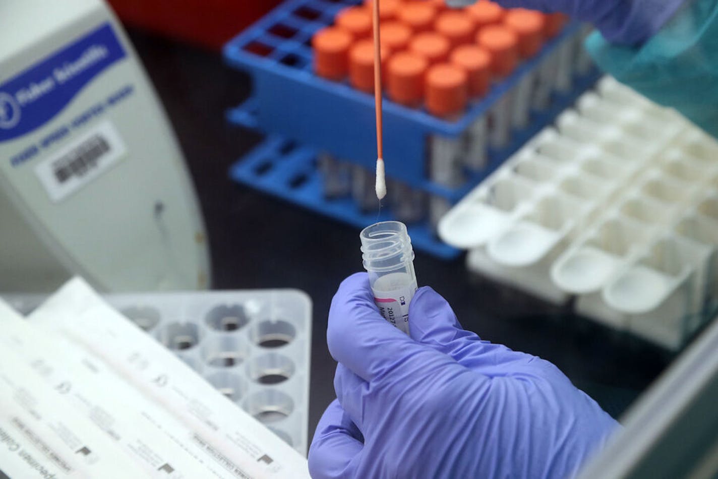 Medical technologist Beatriz Montoya prepares specimens for the analyzer during COVID-19 testing in the lab at Memorial Regional South in Hollywood on May 6, 2020. (Amy Beth Bennett/South Florida Sun Sentinel/TNS) ORG XMIT: 1668823