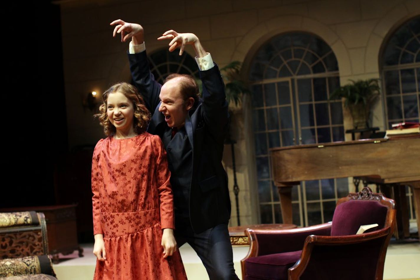 Young Coco (Kacie Riddle) describes a scene from her diary as Tom (Jake Endres) portrays the role of a boy from her childhood, in "Coco's Diary" at History Theatre.