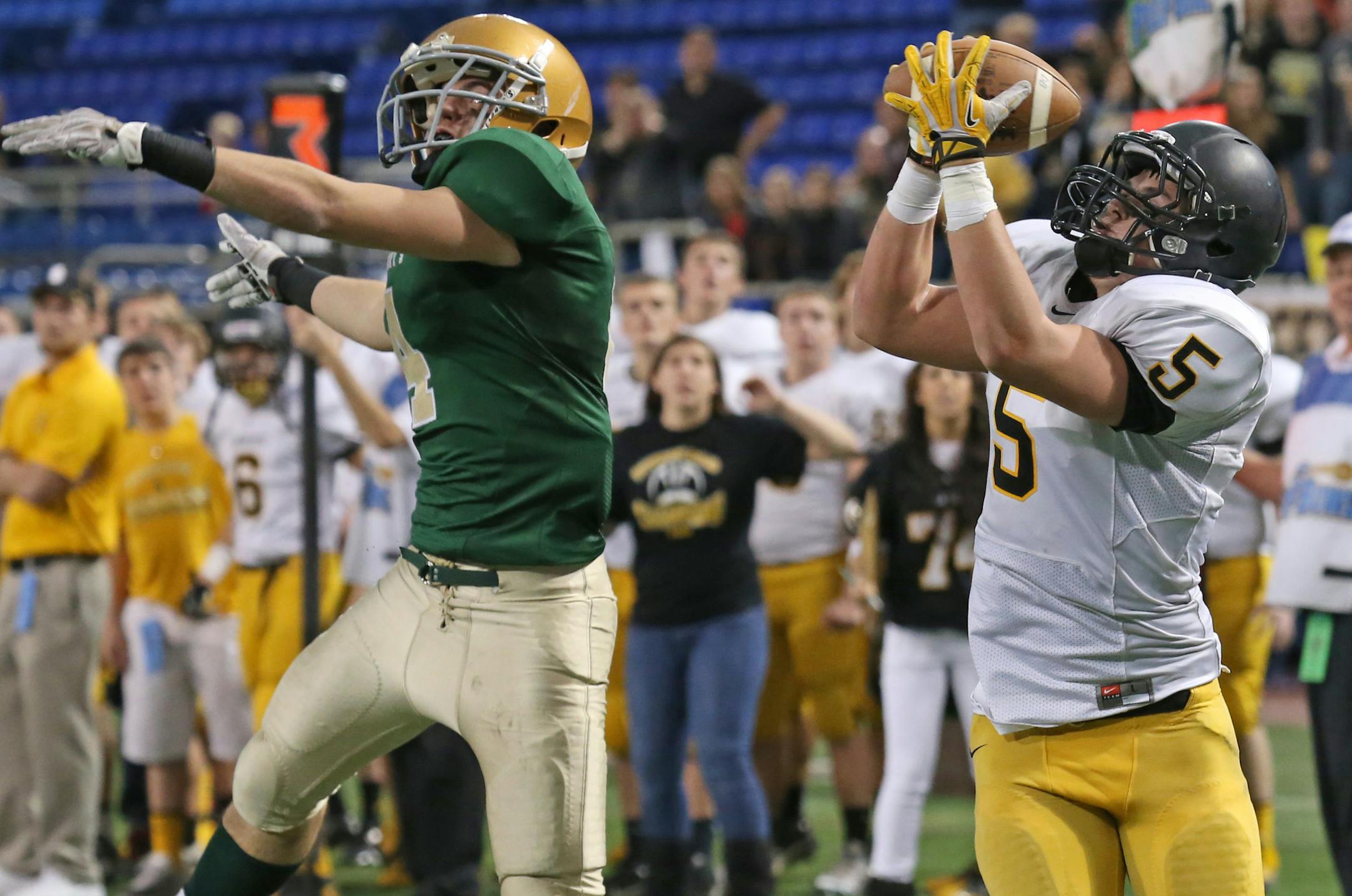 Minnesota State High School Prepbowl, Semifinals, Metrodome, 11/16/13. 1A Sleepy Eye St. Mary's vs Dawson-Boyd (left to right) Sleepy Eye's Jaden Wait defended as Dawson-Boyd's Noah Stelter pulled in a pass and ran into the endzone for a touchdown.] Bruce Bisping/Star Tribune bbisping@startribune.com Jaden Wait, Noah Stelter/roster.