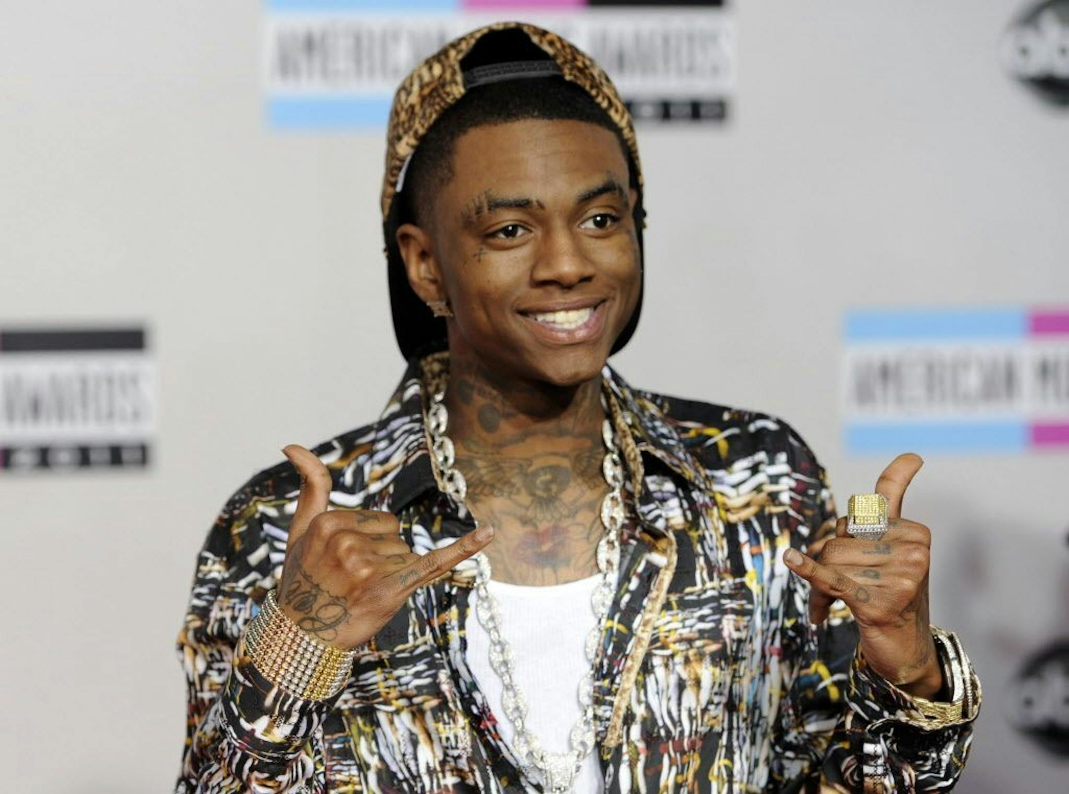 FILE - This Nov. 20, 2011 file photo shows Soulja Boy at the 39th Annual American Music Awards in Los Angeles. Soulja Boy and Chris Brown announced Jan. 4, 2017, that they�ve signed on for a three-round boxing match that will be televised on pay-per-view and promoted by Floyd Mayweather.