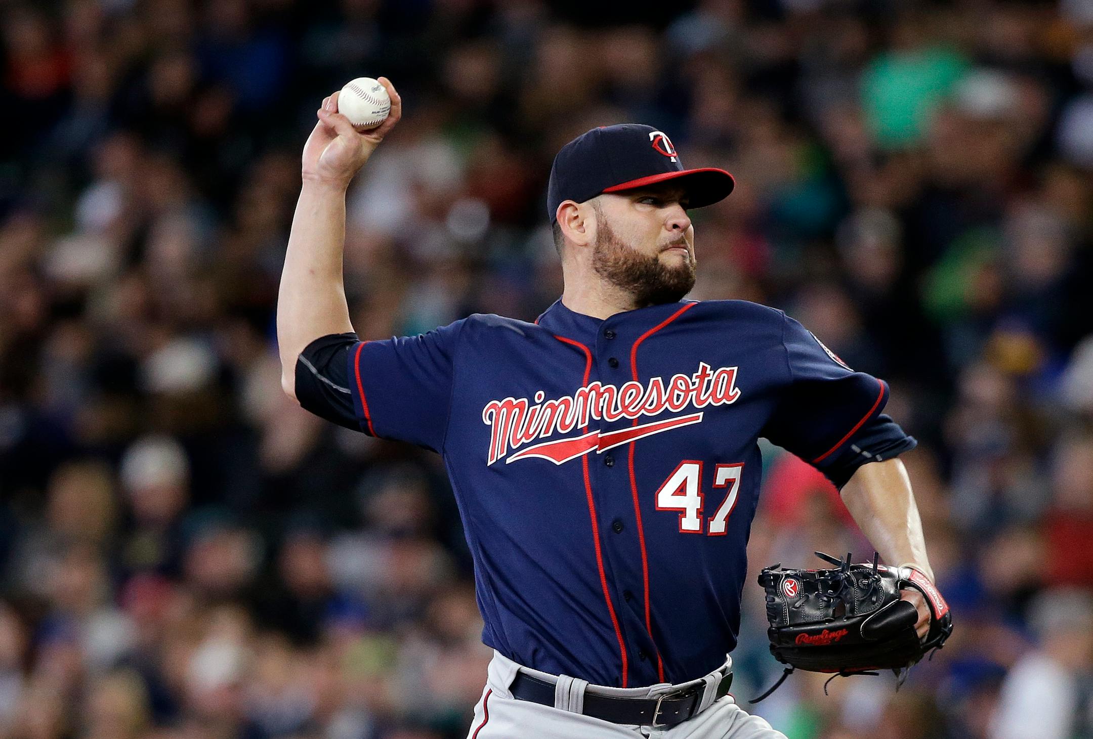 Minnesota Twins starting pitcher Ricky Nolasco throws against the Seattle Mariners in the first inning of a baseball game, Sunday, May 29, 2016, in Seattle. (AP Photo/Elaine Thompson)