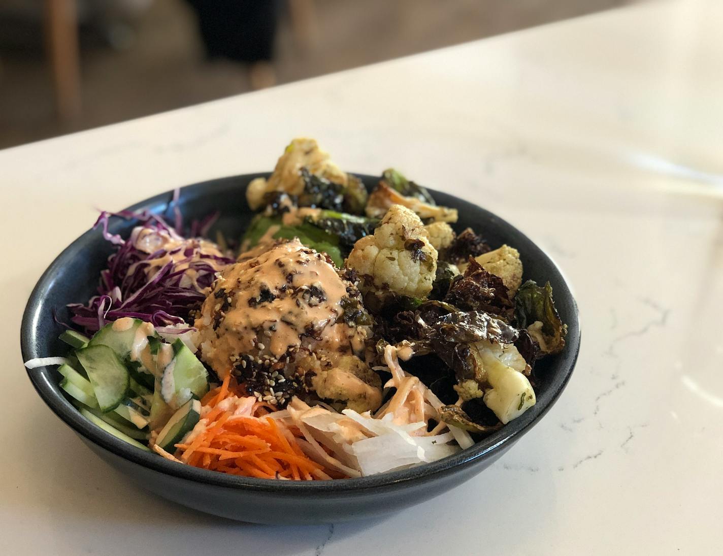 The Cauliflower and Sprouts Chili Crunch Bowl at Nolo's Kitchen & Bar in Minneapolis.