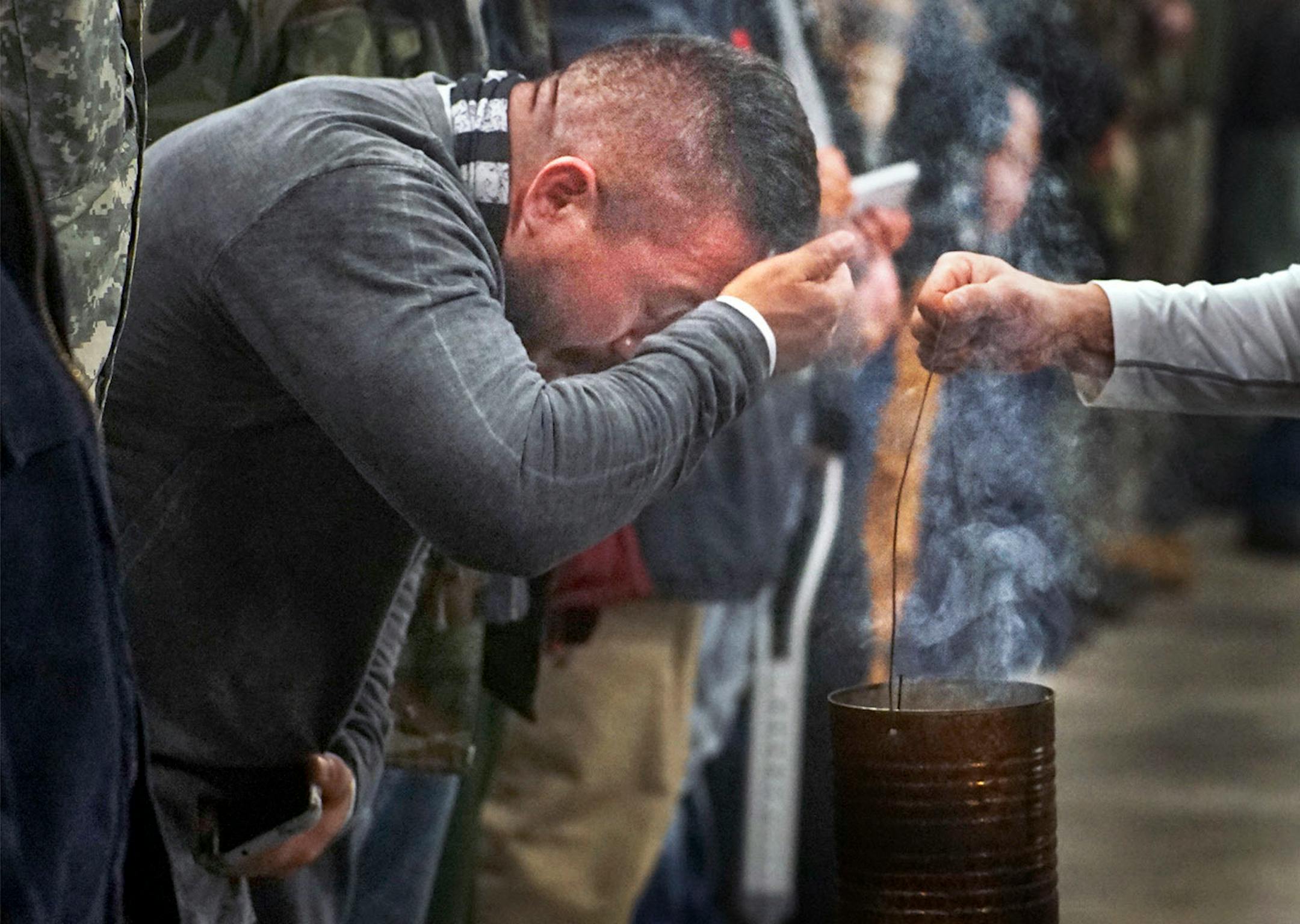 Several hundred veterans attended an orientation at Sitting Bull College. As part of the three-hour session they were cleansed with sage.