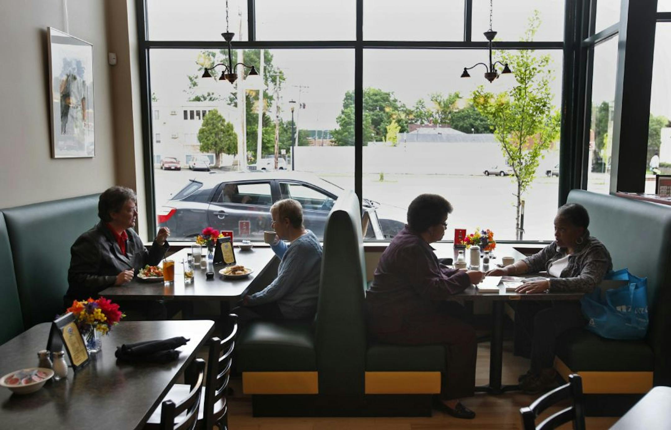 Darryl Weivoda, who has owned or worked at North End Hardware at Lowry & Penn Ave. N. for 30-plus years, has survived recessions, housing bubbles, suburban flight. And he's still investing . . . to the tune of about a half-million over the last few years to acquire a blighted building next to North End, which has spawned several new business. And when Weivoda and his partner couldn't find somebody to open a restuarant, Weivoda opened The Lowry Cafe on his own in May Here, customers Jean Sulze, l