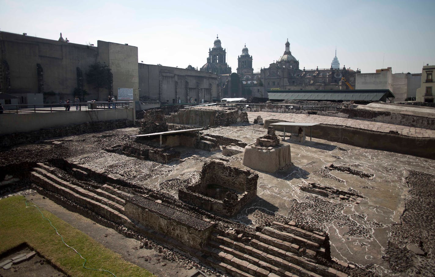 Tourists visit the Templo Mayor archaeological site in Mexico City, Tuesday Dec. 1, 2015. Mexican archaeologists have discovered, at the archaeological site, a long tunnel leading into the center of a circular platform where Aztec rulers were believed to be cremated. The Aztecs are believed to have cremated the remains of their leaders during their 1325-1521 rule, but the final resting place of the cremains has never been found. (AP Photo/Eduardo Verdugo)