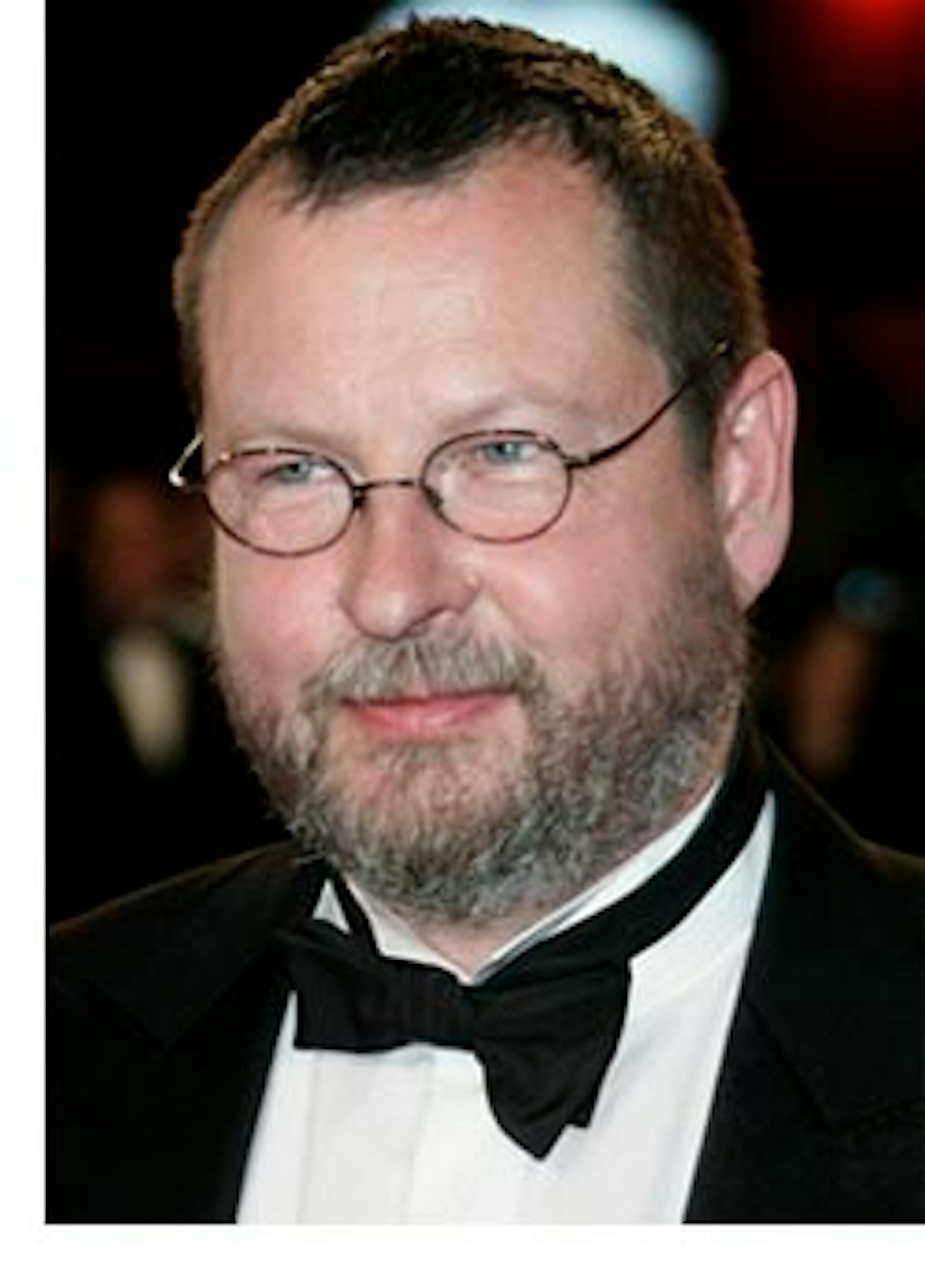 Danish director Lars Von Trier, right, arrives on the red carpet for the screening of the film 'Antichrist', during the 62nd International film festival in Cannes, southern France, Monday, May 18, 2009. (AP Photo/Francois Mori)