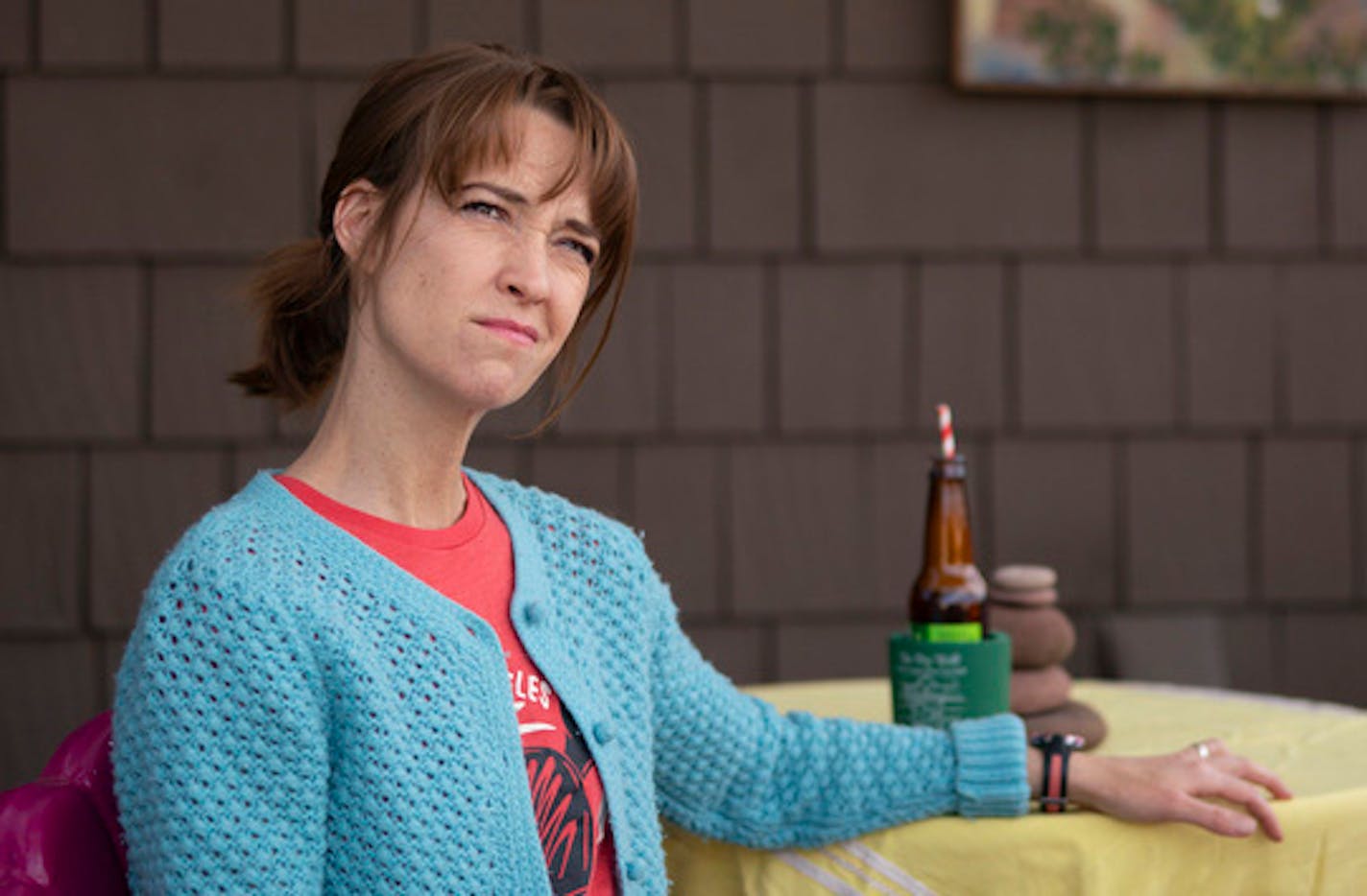 Comedian Mary Mack with a gluten-free beer on the deck in the back yard of her Minneapolis home.