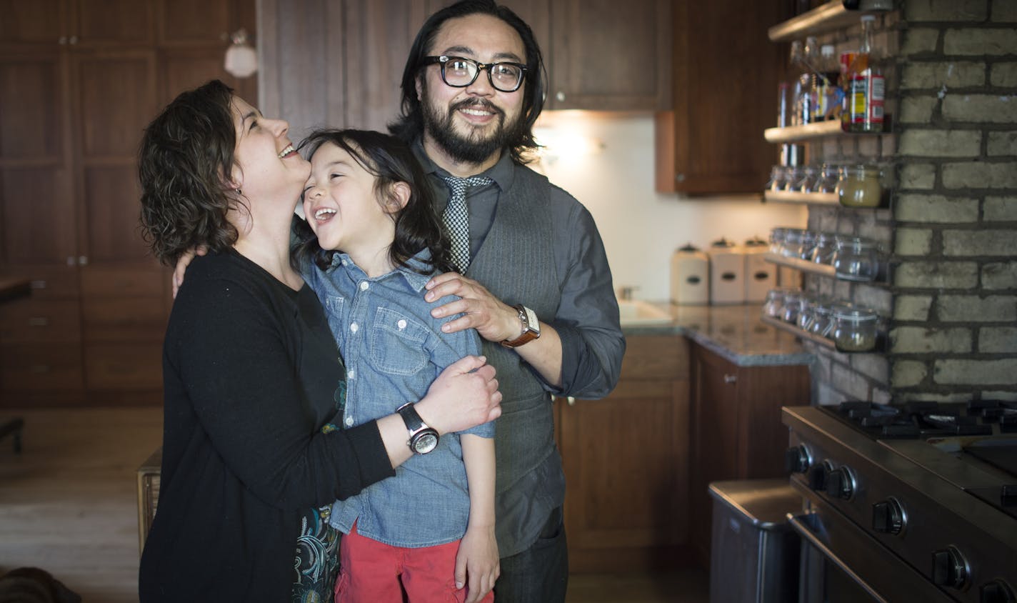 Hai Truong, chef and owner of Ngon Vietnamese Bistro in St. Paul, is pictured alongside his 4-year-old son Khanh and wife Jessica.