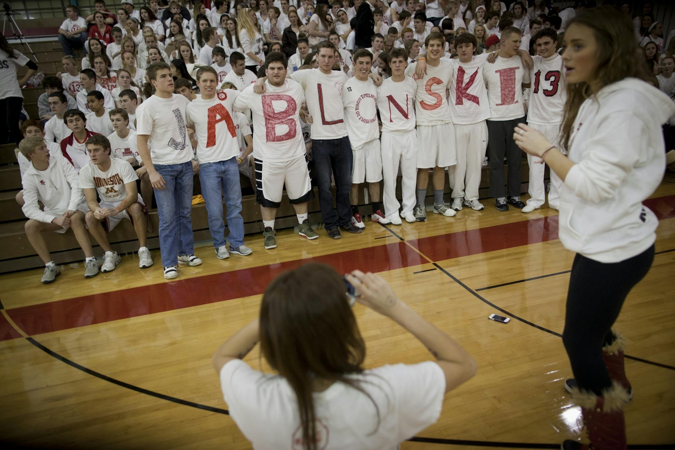 Benilde St. Margaret students posed for pictures with their friends wearing T-shirts spelling the last name Jablonski in honor of their fellow Benilde student and friend Jack Jablonski who was paralyzed in a hockey accident last week, on January 5, 2012 at a home Benilde St. Margaret basketball game in St. Louis Park, Minn..