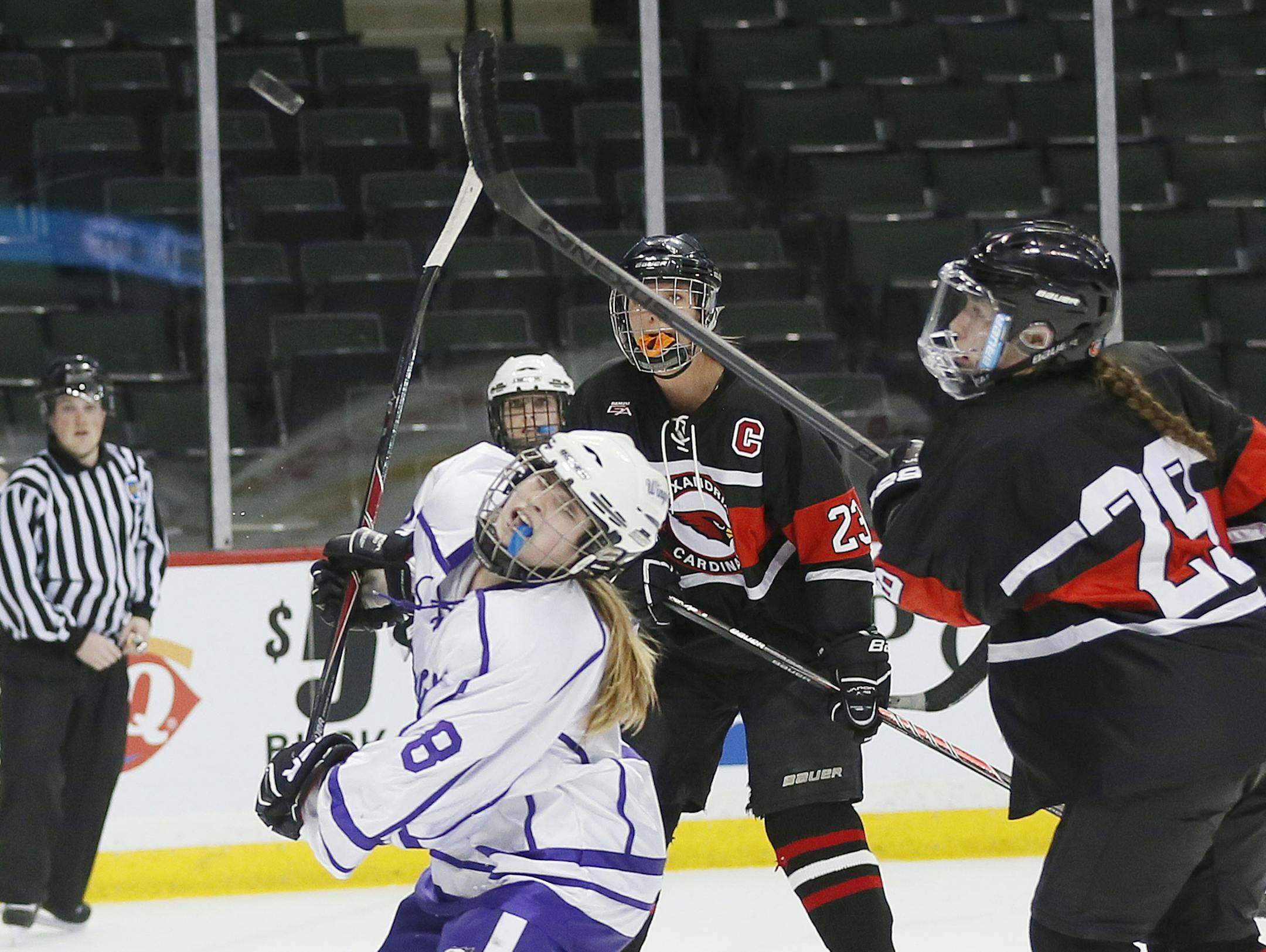 Jenna Gillund of Red Wing keep her eyes on the puck during the second peroid Red Wing played Alexandria in the Class 1A hockey quarterfinals at Xcel Energy Center Wednesday February 18, 2015 in St. Paul, MN. ] Jerry Holt/ Jerry.Holt@Startribune.com