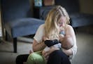 Ariel Landsberger held her son Sonney as she attempted to breastfeed him at their home in Minneapolis, Minn., on Tuesday, November 4, 2014. The young 