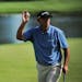 Tom Lehman held up his ball after finishing the final round of the 3M championship August 7, 2011 held at TPC Twin Cities in Blaine. Jay Haas took fir