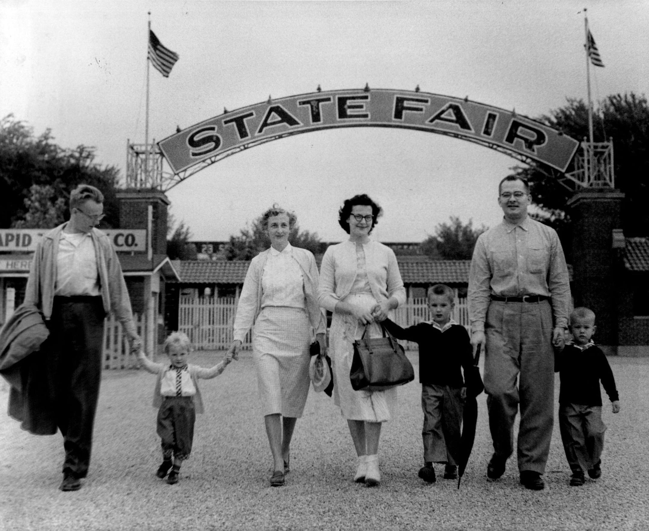August 23, 1958 First Families: Early arrivals on the opening morning of the Minnesota State fair today were these two Minneapolis families. At left are Mr. and Mrs. Hal Rindal, 5412 S. 42nd Av., with their daughter, Karen. The other parents are Mr. and Mrs. Ross Farmer, 4522 Arden Av., with their sons, Jeffrey, 5, and Mark, 3. William Seaman, Minneapolis Star Tribune
