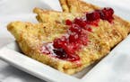 Homemade Swedish pancakes with berry compote.