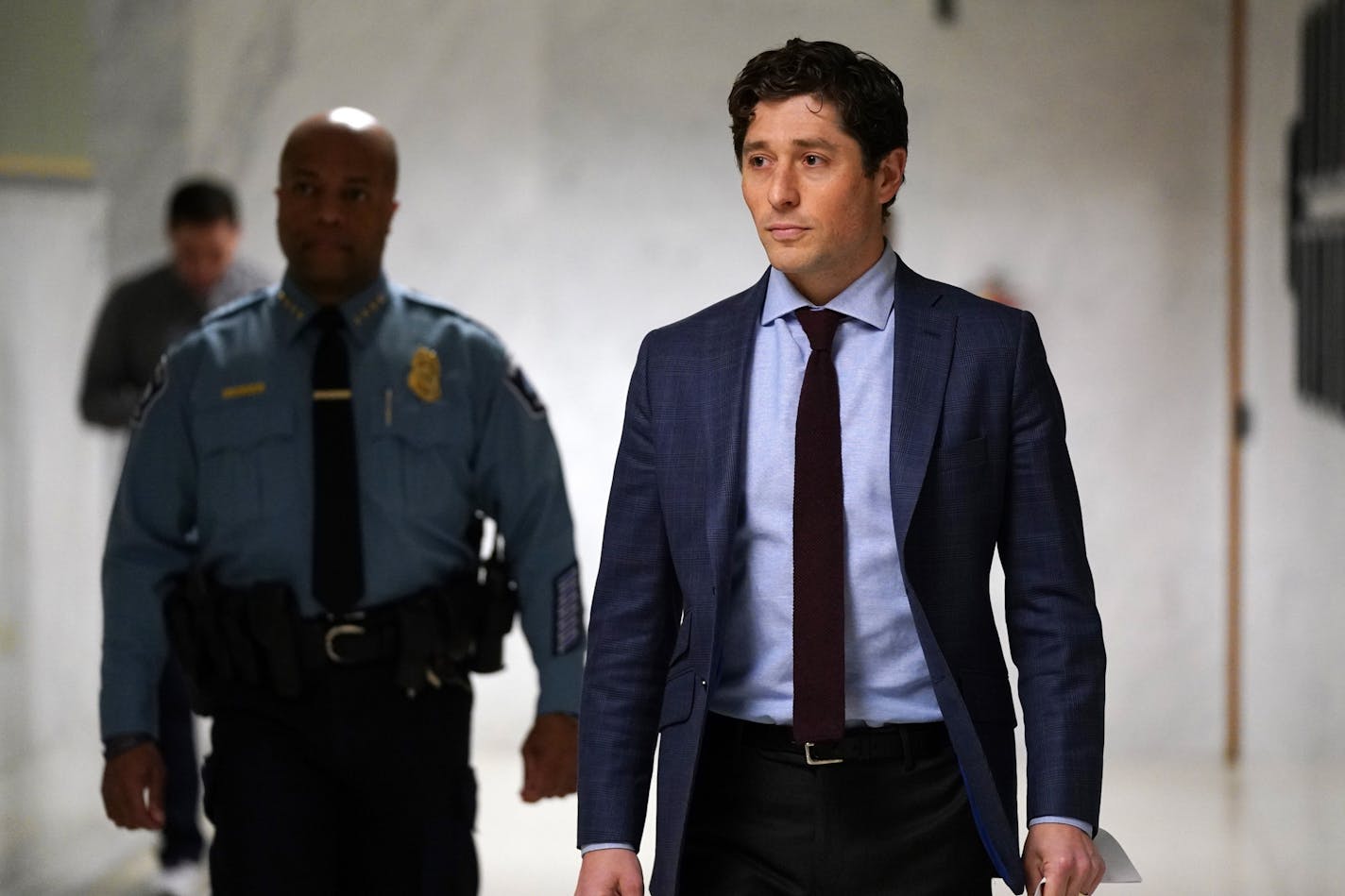 Minneapolis Mayor Jacob Frey, walking a distance from police Chief Medaria Arradondo, arrived at a press conference to outline how the city will enforce the new stay-at-home order Friday.