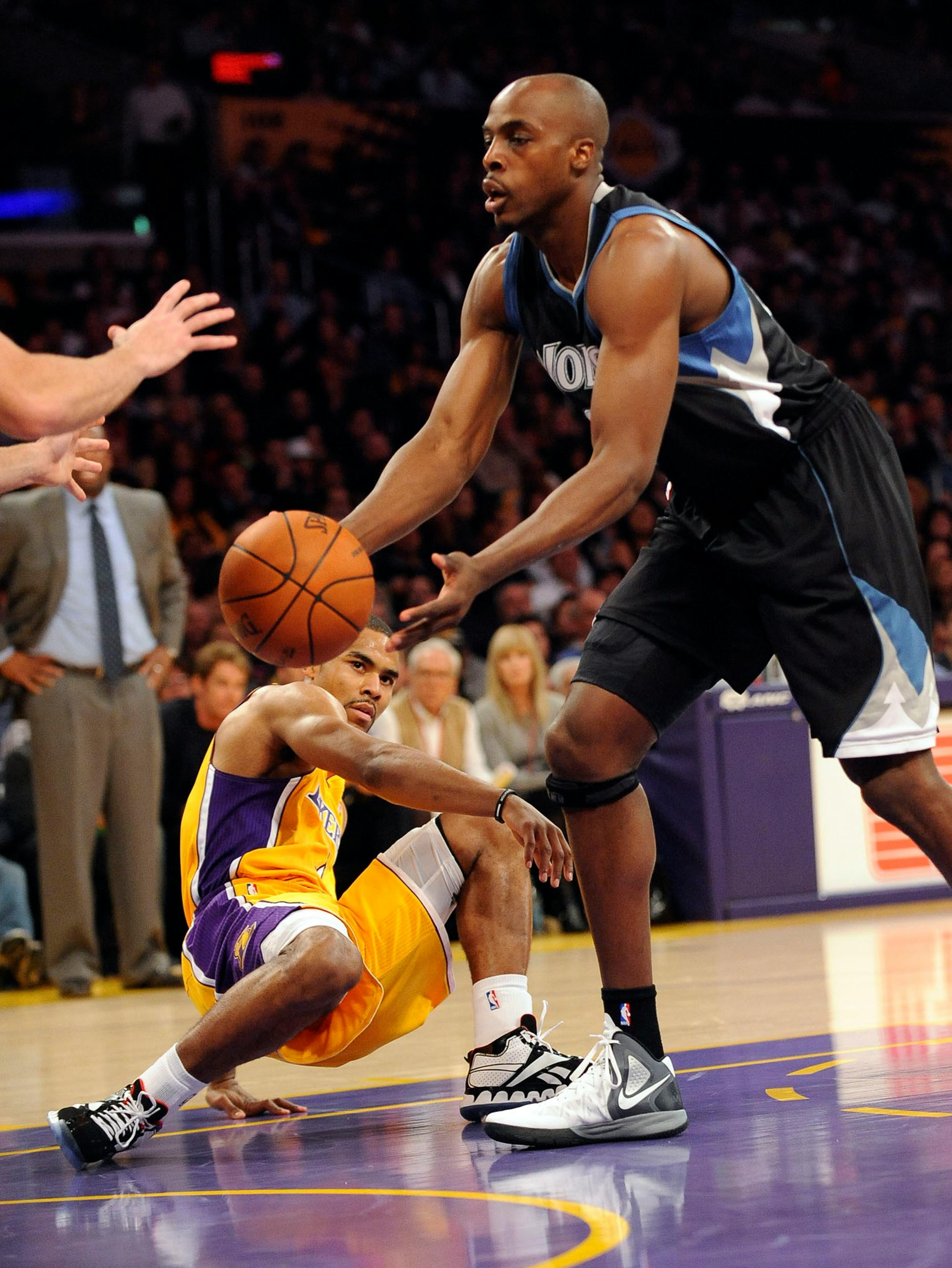 The Los Angeles Lakers' Ramon Sessions loses his balance as the Minnesota Timberwolves' Anthony Tolliver steals the ball in the first half at the Staples Center in Los Angeles, California, on Friday, March 16, 2012. The Lakers prevailed, 97-92. (Rose Palmisano/Orange County Register/MCT)