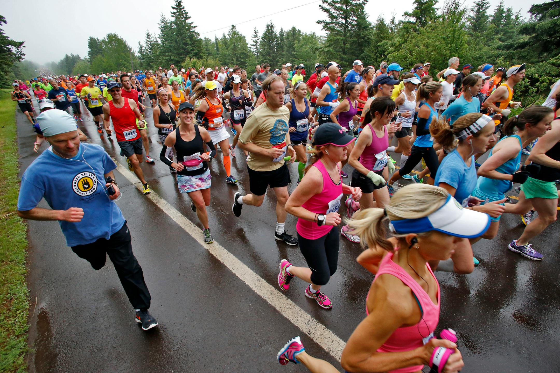 Runners race by a mile from the start. ] The 38th running of Grandmas Marathon from Two Harbors to Canal Park in Duluth. (MARLIN LEVISON/STARTRIBUNE(mlevison@startribune.com)