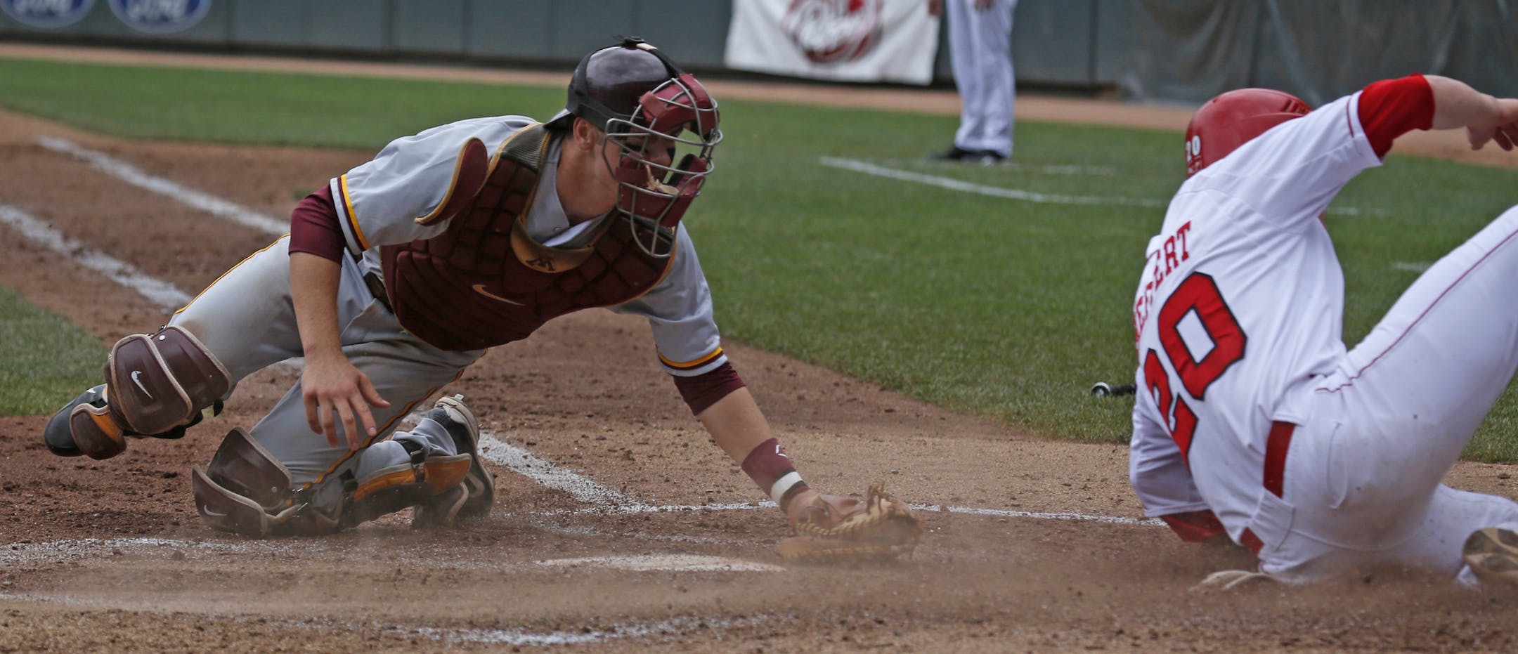 University of Minnesota vs. Nebraska, Big 10 Baseball Tournament, Target Field, 5/24/13. (left to right) Minnesota's Matt Halloran couldn't make the tag, as Nebraska's Josh Scheffert slide home safe in 4th inning action at Target Field.] Bruce Bisping/Star Tribune bbisping@startribune.com Matt Halloran, Josh Scheffert/roster.