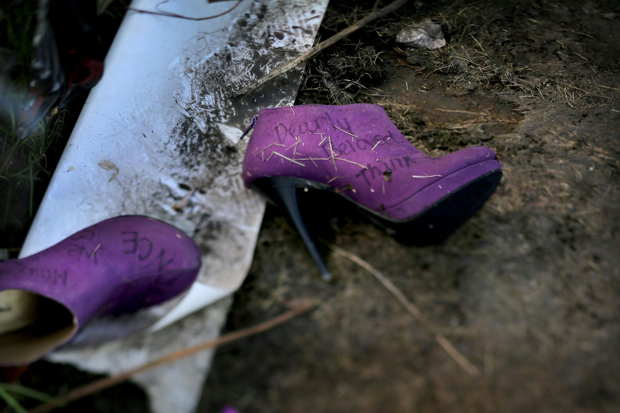 A pair of purple pumps were left behind as a memento by a Prince fan outside Paisley Park Monday May 16, 2016, in Chanhassen, MN.