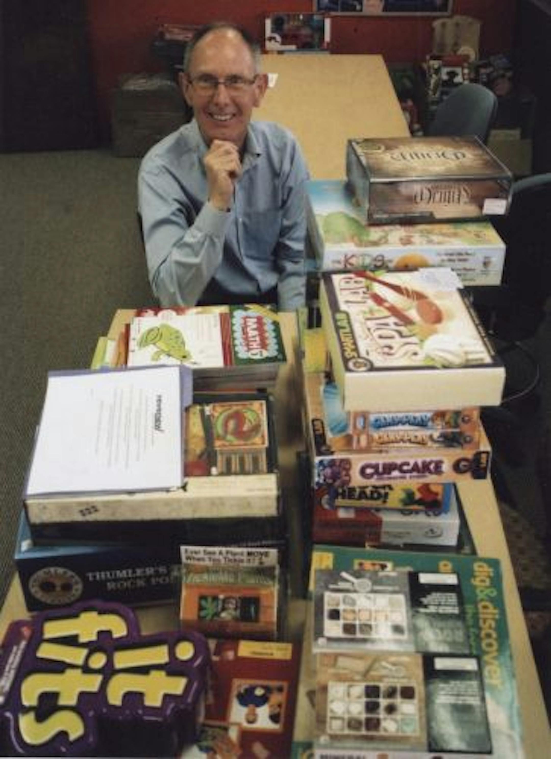 MindWare ceo Martin Smith is shown with some of the more than 280 "brainy" toys, games, puzzles and science experiments the roseville company offers.