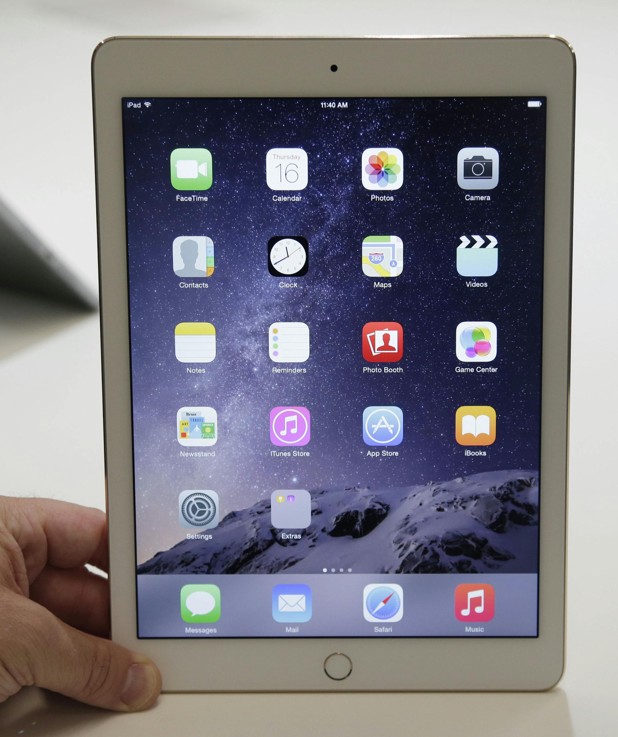 The iPad Air 2 is on display at Apple headquarters on Thursday, Oct. 16, 2014 in Cupertino, Calif. Apple unveiled the thinner iPad with a faster processor and a better camera as it tries to drive excitement for tablets amid slowing demand. (AP Photo/Marcio Jose Sanchez)