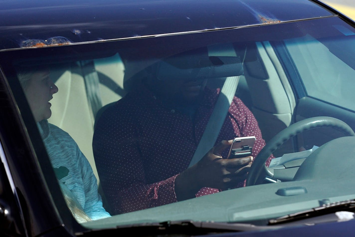 Under Minnesota law, drivers are not allowed to have a cellphone or other electronic device in their hand while at the wheel. Drivers can touch their phone once to make a call, send voice-activated text messages or listen to podcasts.