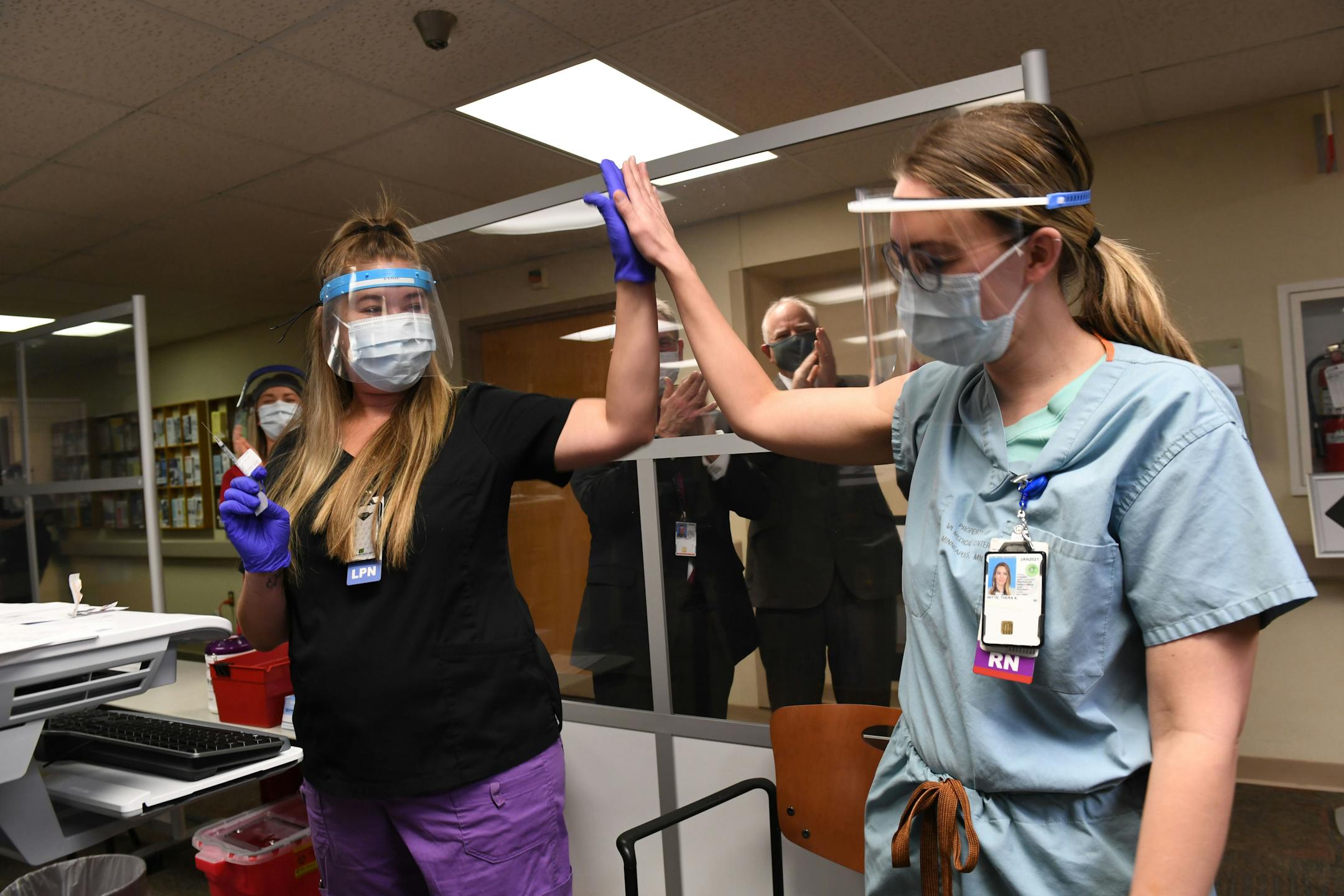 Thera Witte, RN, right, received the COVID-19 vaccine on Dec. 15, 2020 at the Minneapolis VA hospital.