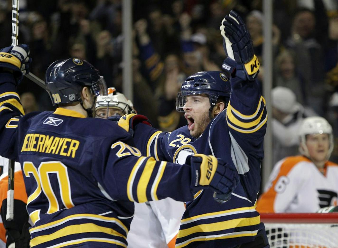 Sabres captain Jason Pominville, right.