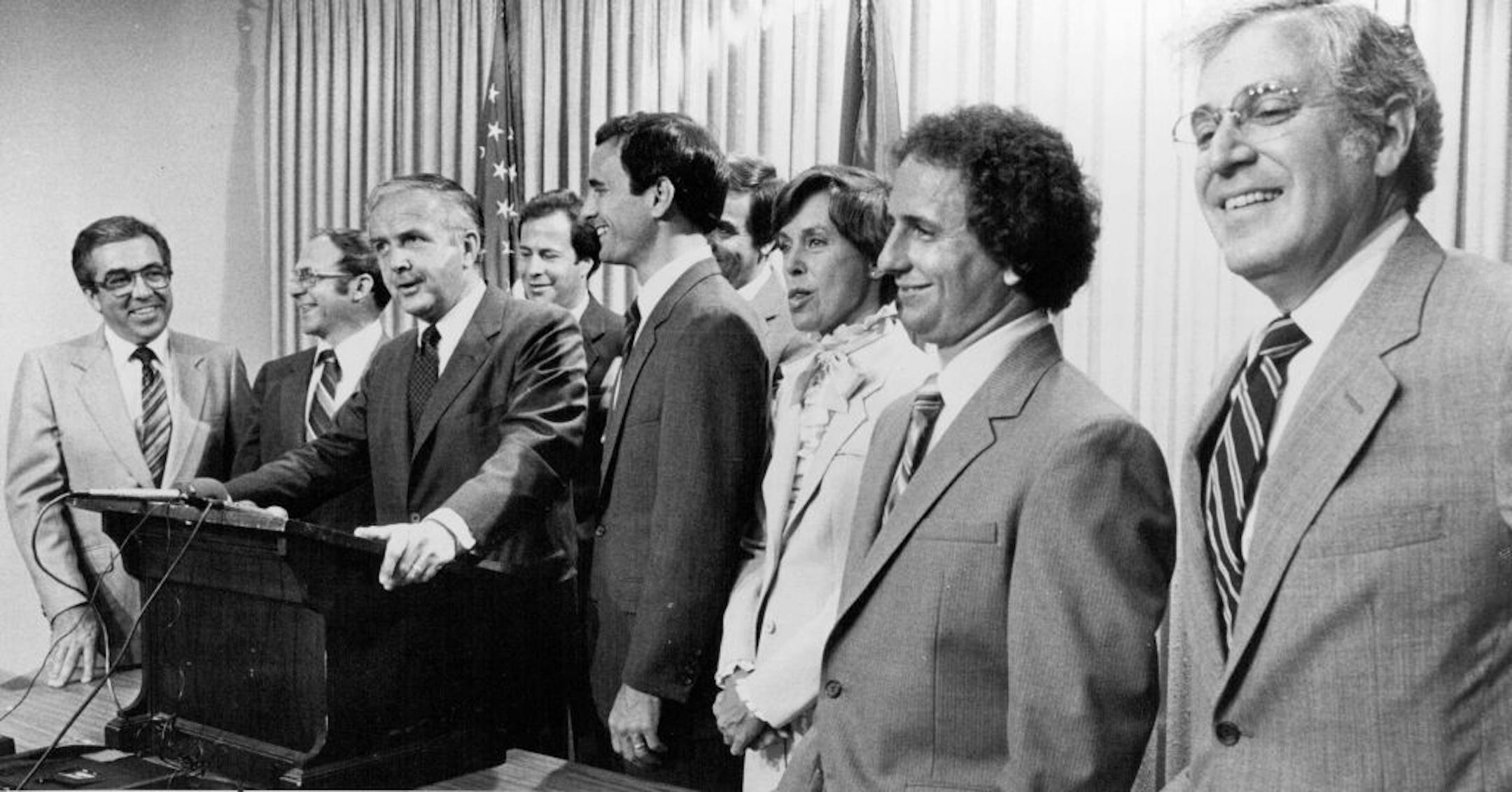 July 7, 1982 DFL candidates lined up at the state office building Tuesday after filing for office. From left: Irv Stern (candidate for treasurer); Carl Johnson (lieutenant governor); Warren Spannaus (governor); Gerry Sikorski (U.S. representative); Mark Dayton (U.S. senator); U.S. Rep. Bruce Vento (partly hidden); Secretary of State Joan Growe; Paul Wellstone (auditor), and Skip Humphrey (attorney general). June 5, 1982 July 8, 1982 Marlin Levison, Minneapolis Star Tribune