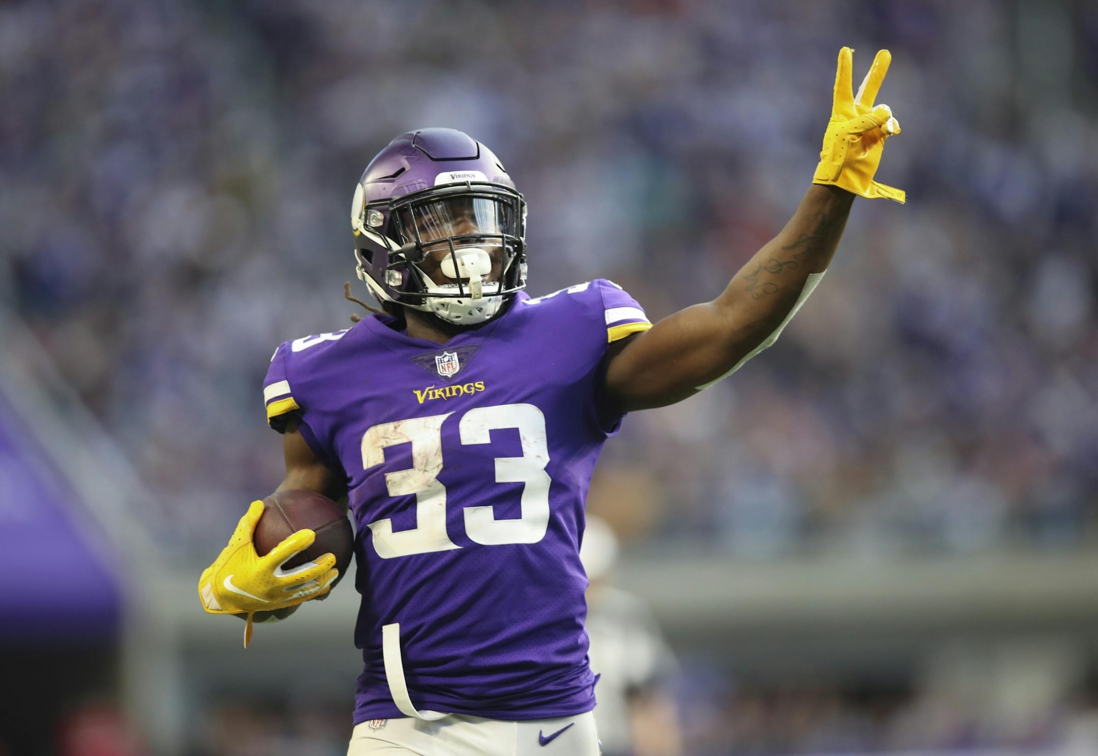 Minnesota Vikings running back Dalvin Cook held up two fingers to signify his second touchdown of the game after his 21 yard scoring run in the fourth quarter.