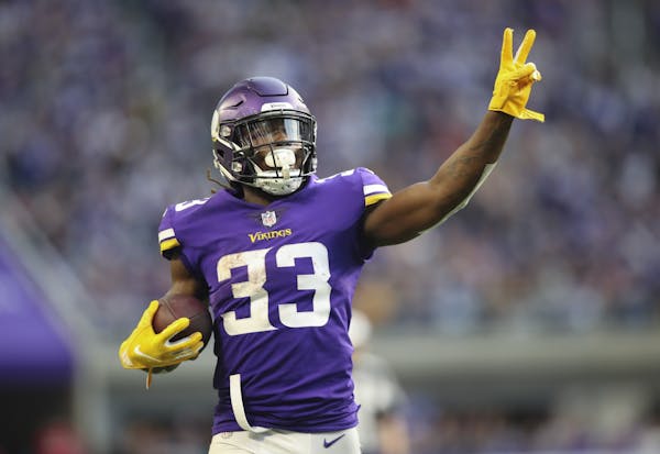 Minnesota Vikings running back Dalvin Cook held up two fingers to signify his second touchdown of the game after his 21 yard scoring run in the fourth