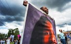 John Thompson, who said he was a close friend of Philando Castile, protests during a demonstration, Sunday, June 18, 2017, in St. Anthony, Minn. The p