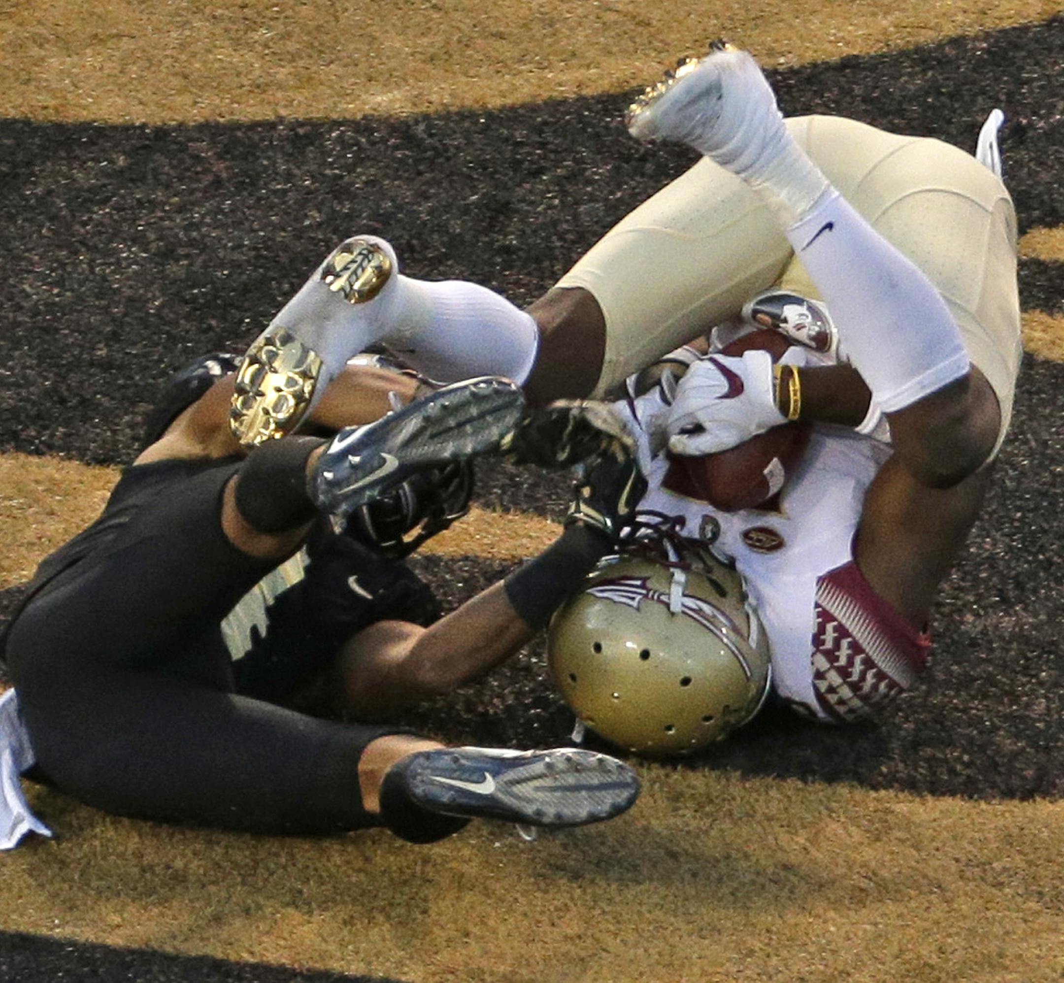 Florida State's Auden Tate, right, catches a touchdown pass as Wake Forest's Amari Henderson, left, defends late in the second half of an NCAA college football game in Winston-Salem, N.C., Saturday, Sept. 30, 2017. (AP Photo/Chuck Burton)