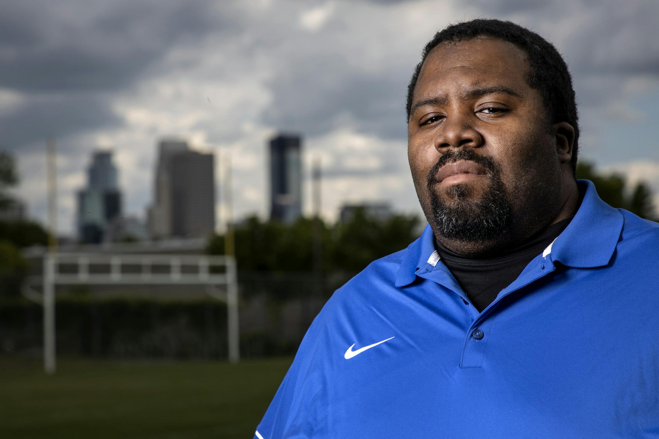 Minneapolis North High School football coach Charles Adams. ] CARLOS GONZALEZ • cgonzalez@startribune.com – Minneapolis, MN – June 24, 2020, Charles Adams at Minneapolis North High School, where he played football in high school, now coaches football and until recently served as a community resource officer in the school.
