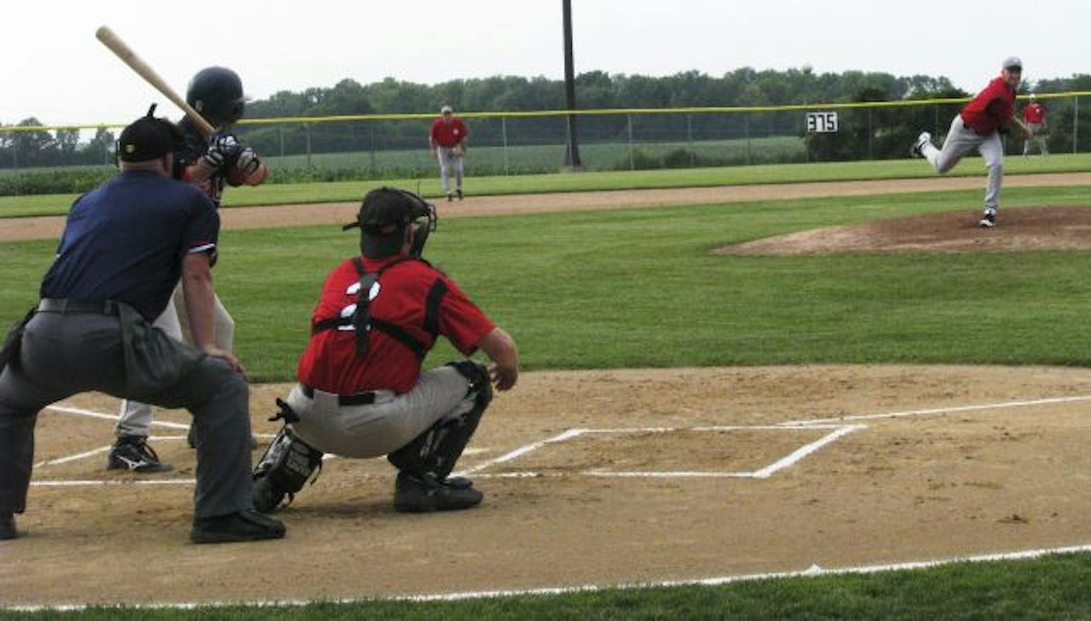 Vikings offensive coordinator Darrell Bevell pitches in town ball during the offseason for the Eden Prairie Lions Tap senior team. Said team manager Pat Thompson: "Darrell's always got a smile on his face, but you can see the very serious side of him and his intensity."