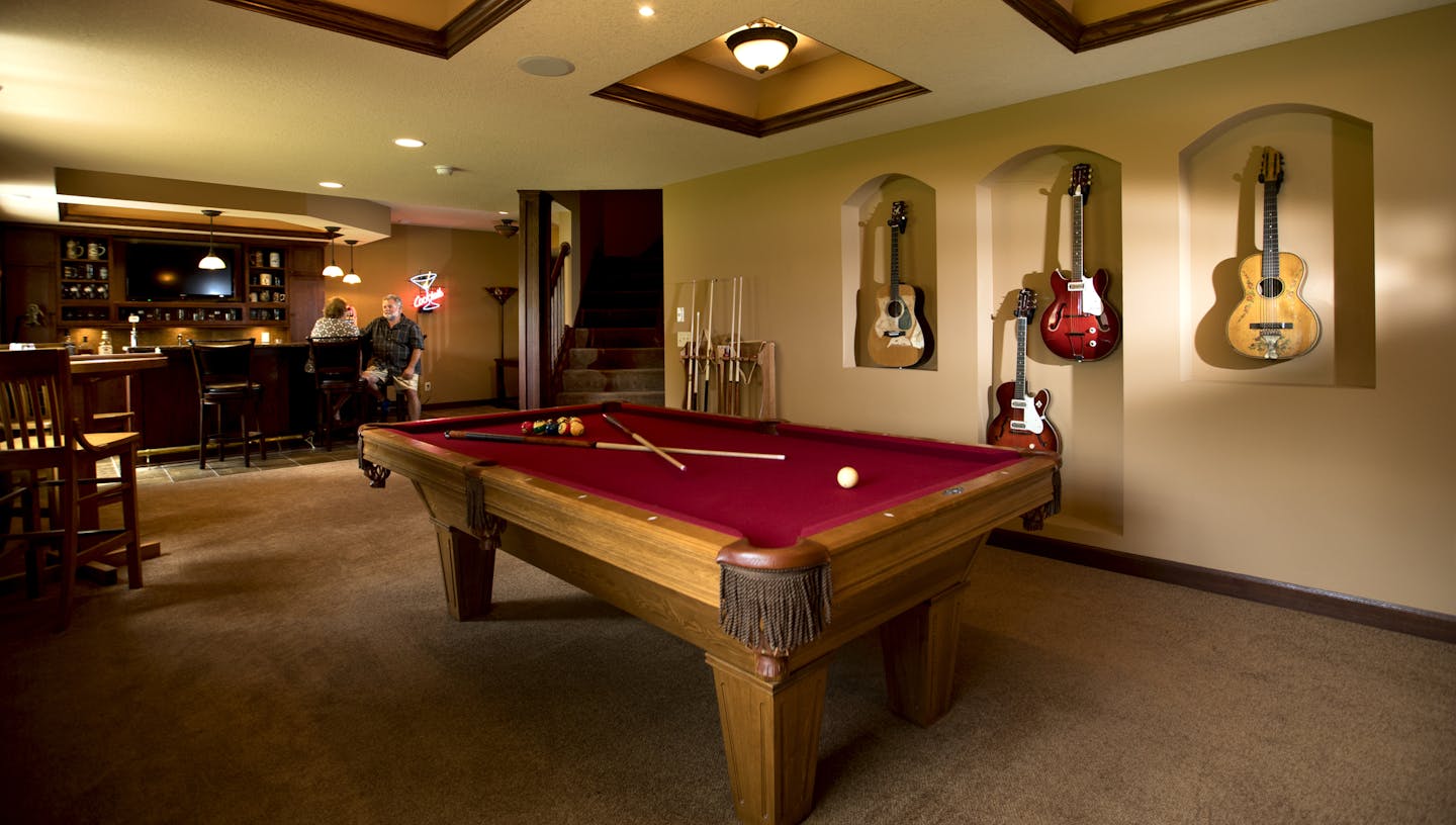 Mary and Mitchell Roach's $100k finished basement in their 4000 square foot home on Tuesday, August 2, 2016, in Savage, Minn. The basement includes a bedroom, bathroom, bar, entertainment center and pool table room. ] RENEE JONES SCHNEIDER &#x2022; renee.jones@startribune.com After putting their 4,000-plus square-foot house in Savage on the market in April, Mary and Mitchell Roach have done three price reductions and still no offers. Their neighbors were in the same boat and were so frustrated t