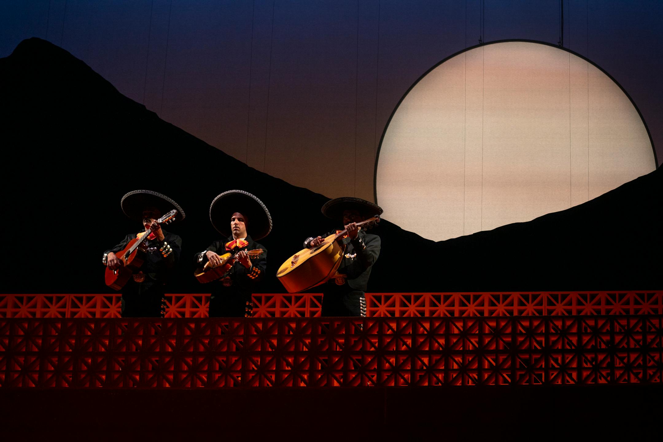 (from left) Ivan Fontanez, Rodolfo Nieto and Israel Aranda, as the three mariachi musicians, sing and strum during a dress rehearsal for the opera "Cruzar la Cara de la Luna" at the Ordway Music Theatre in St. Paul, Minn. on Saturday, Oct. 28, 2023. Premiering Saturday Nov. 4, this will be the Minnesota Opera's first mariachi opera, tackling identity and the intergenerational struggles of a Mexican-American family. ]