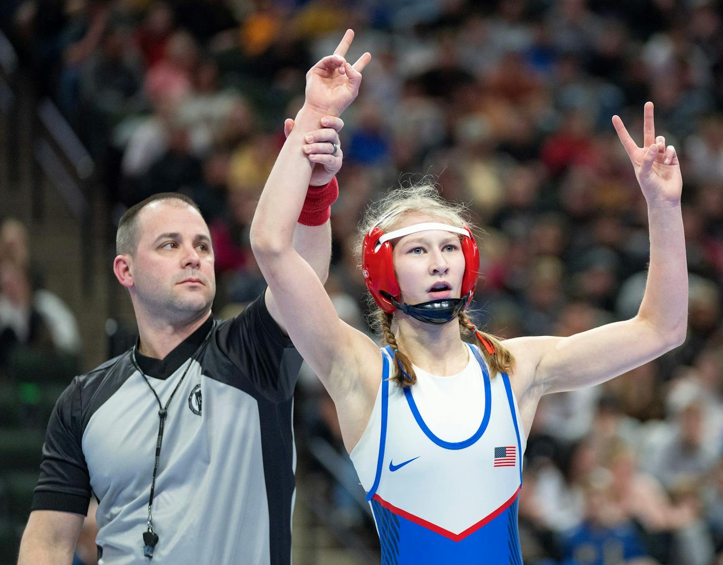 Simley wrestler Charli Raymond celebrates after defeating Fridley wrestler Olivia Sackor during the MSHSL wrestling state tournament championships Saturday, March 4, 2023 at Xcel Energy Arena in St. Paul, Minn. ]