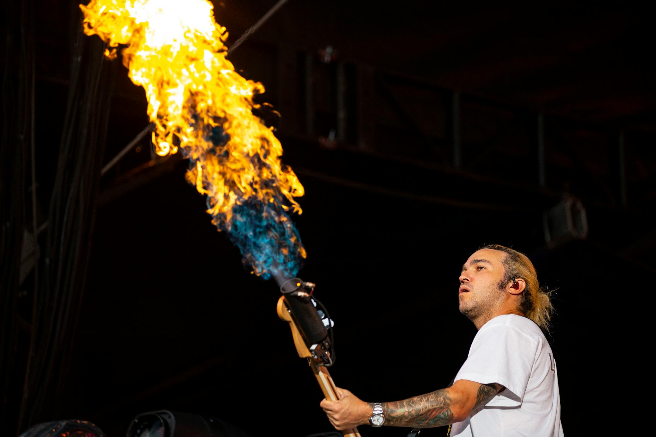 Pete Wentz, bassist for Fall Out Boy, shot flames out of his bass during the band's opening song at the Hella Mega Tour at Target Field in Minneapolis on Monday.