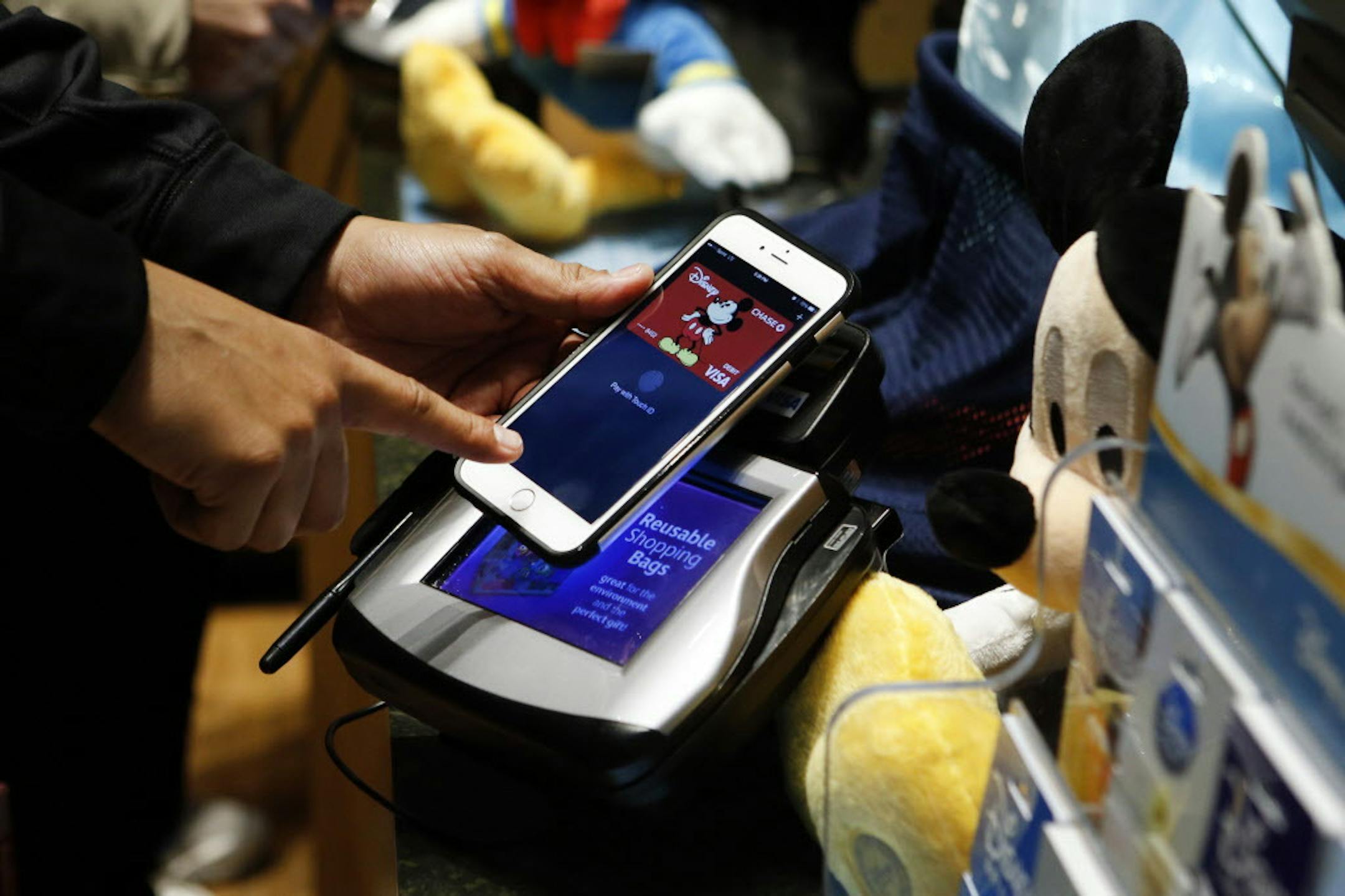 IMAGE DISTRIBUTED FOR DISNEY - This Disney Store location in New York's Times Square begins accepting Apple Pay for retail transactions, Monday, Oct. 20, 2014. (Photo by Jason DeCrow/Invision for Disney/AP Images)
