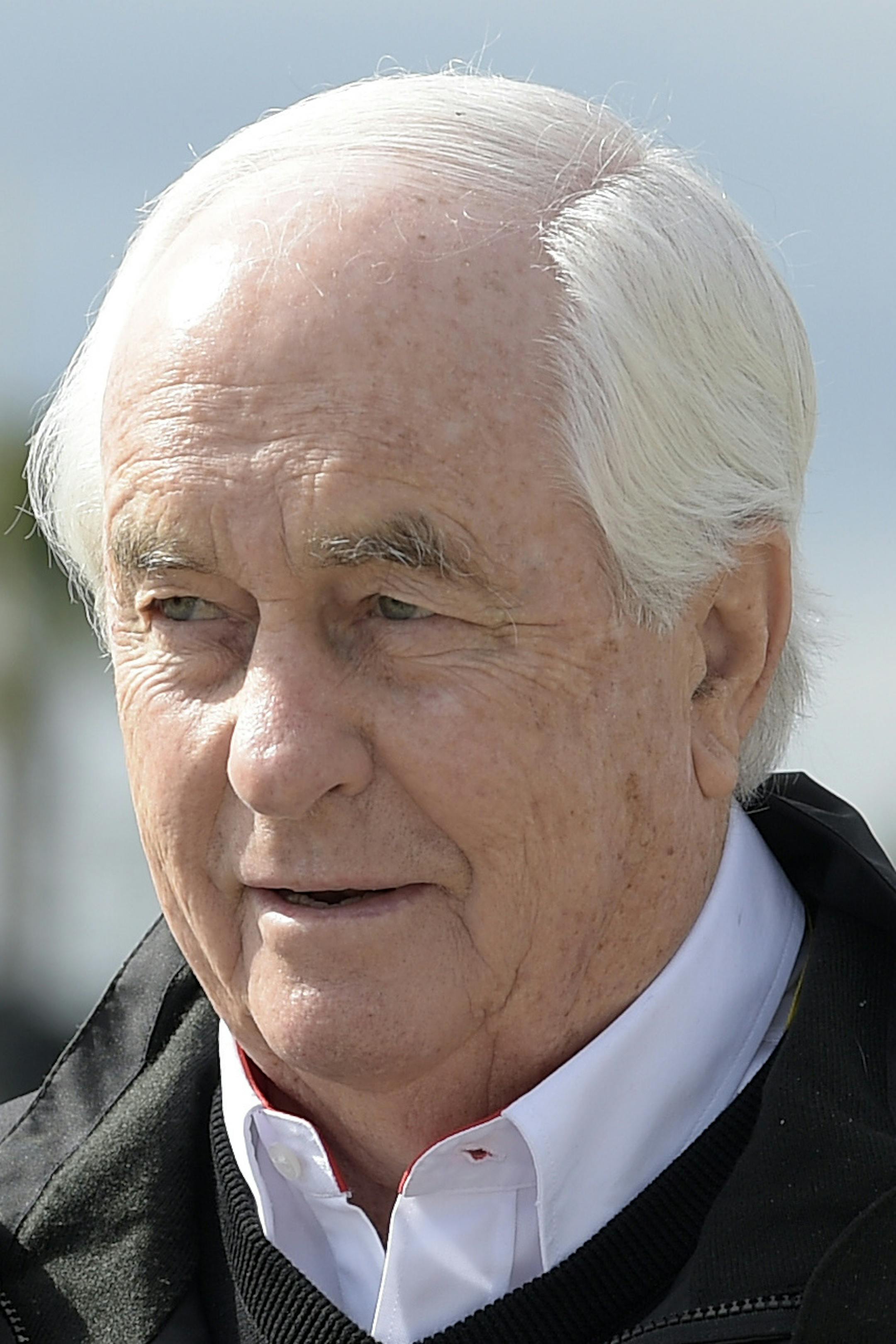 Team owner Roger Penske walks through the garage before practice for the Daytona 500 NASCAR Sprint Cup series auto race at Daytona International Speedway in Daytona Beach, Fla., Saturday, Feb. 21, 2015. (AP Photo/Phelan M. Ebenhack) ORG XMIT: DBR110