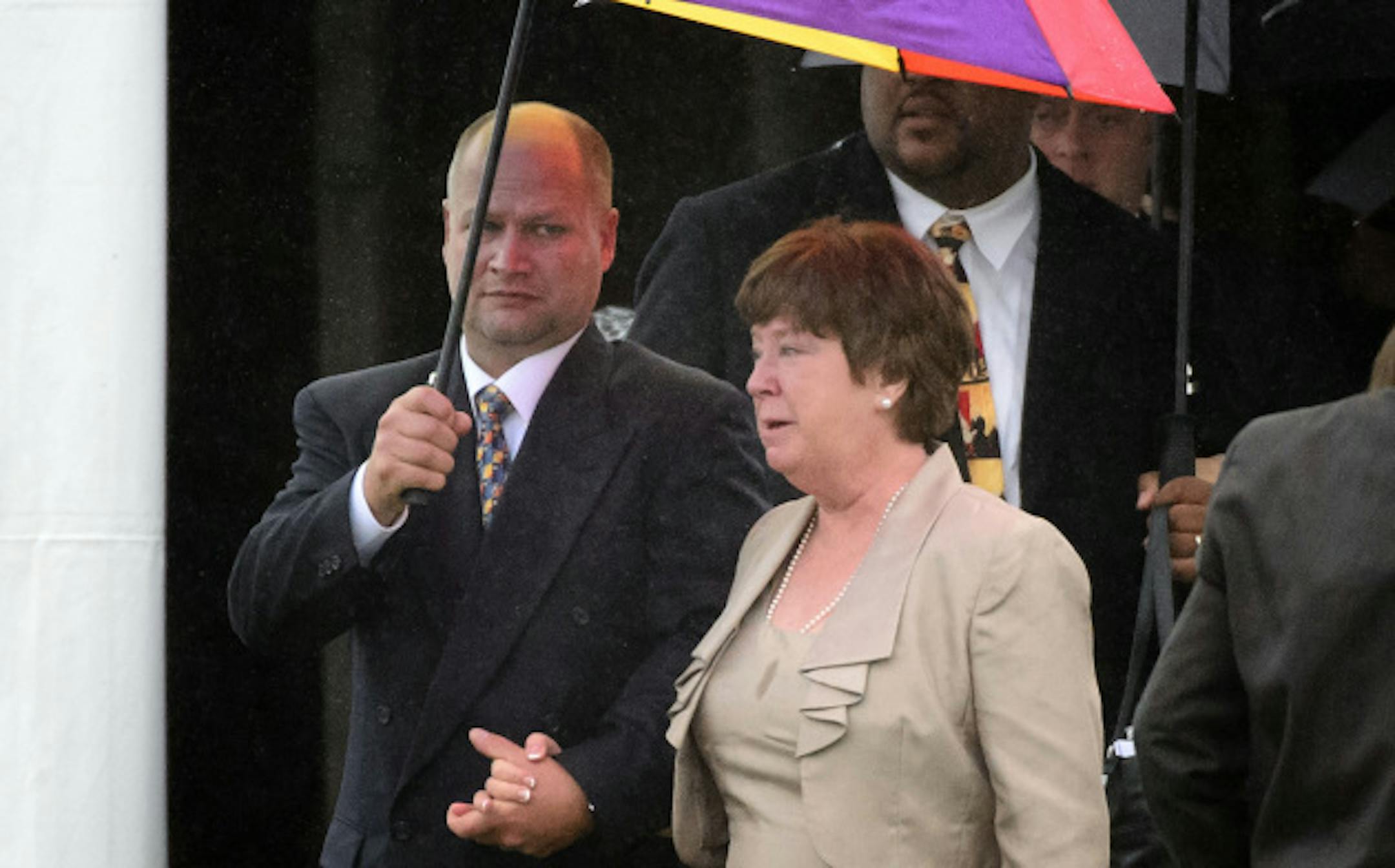 Rod Grams wife Christine was escorted to her vehicle after the service.  Sen. Rod Grams funeral service, Tuesday, October 15, 2013   A large tent was erected next to the Zion Lutheran Church in St. Francis to handle the large crowd.      ]   GLEN STUBBE * gstubbe@startribune.com