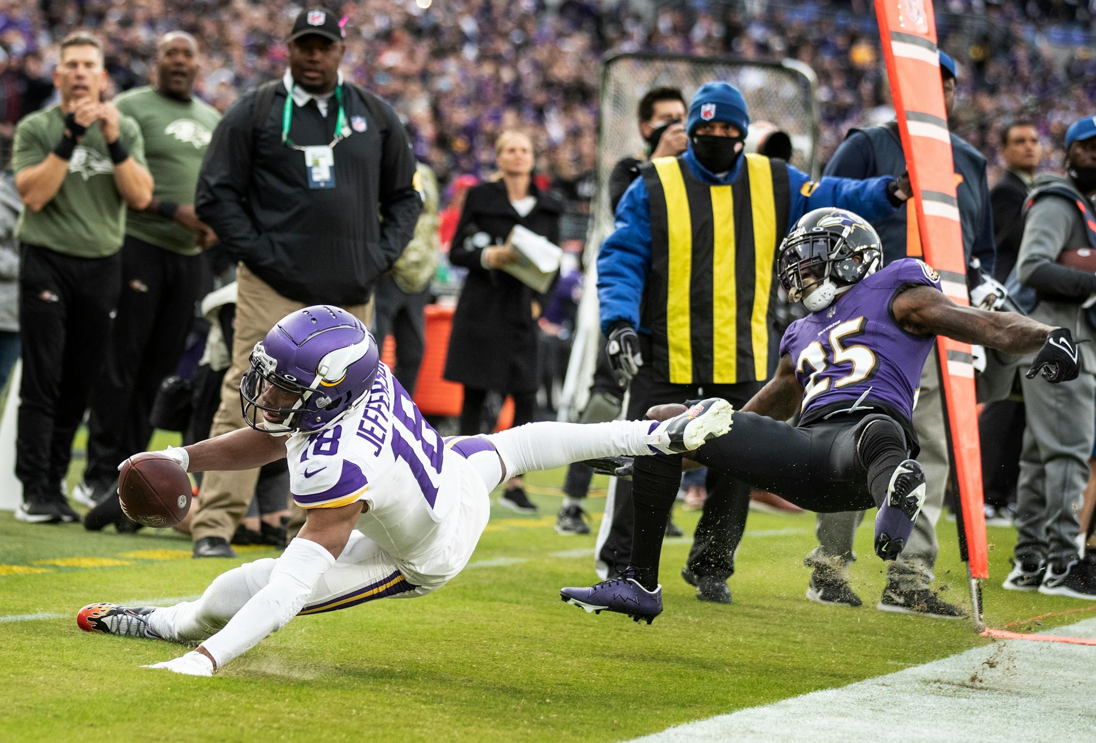 Minnesota Vikings wide receiver Justin Jefferson (18), was pushed out-of-bounds by Baltimore Ravens cornerback Tavon Young (25) in the fourth quarter.